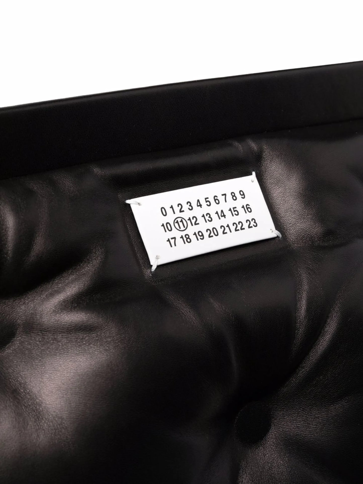 numbers-motif quilted clutch bag