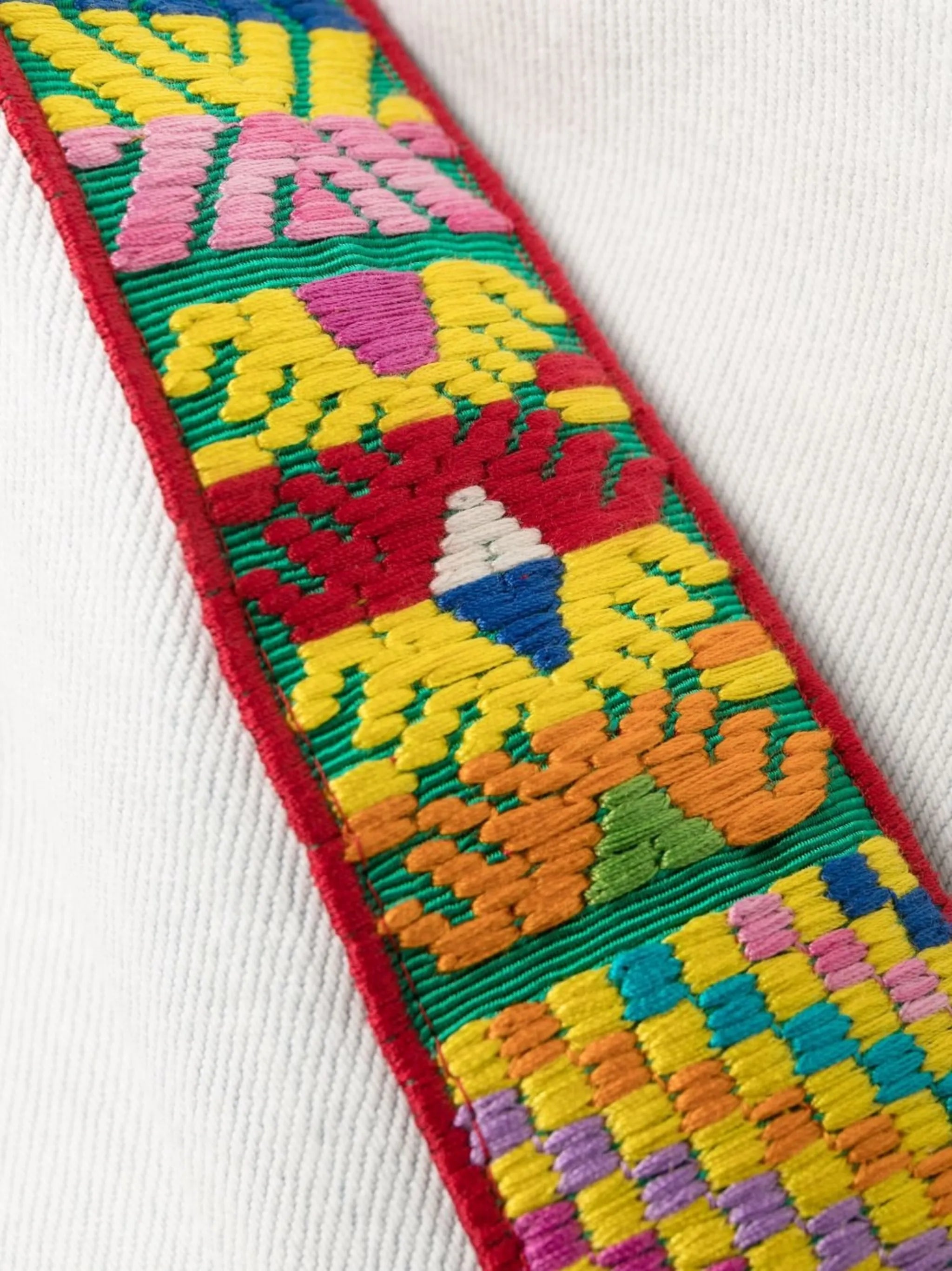 embroidered-trim straight-leg jeans