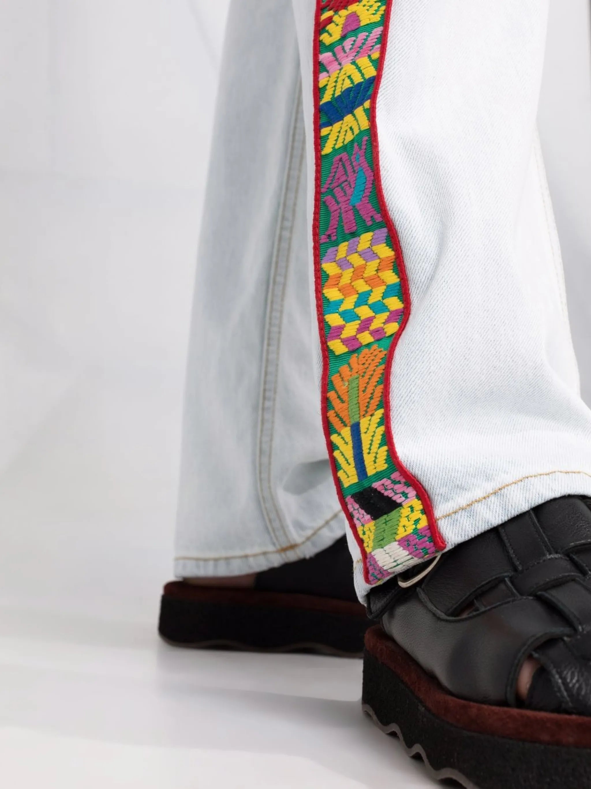 embroidered-trim straight-leg jeans