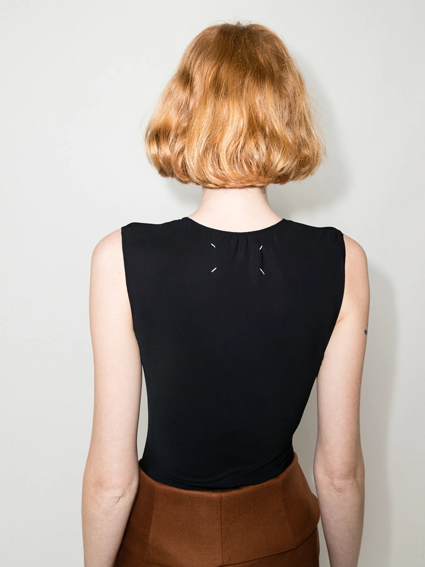 four-stitch logo bodysuit