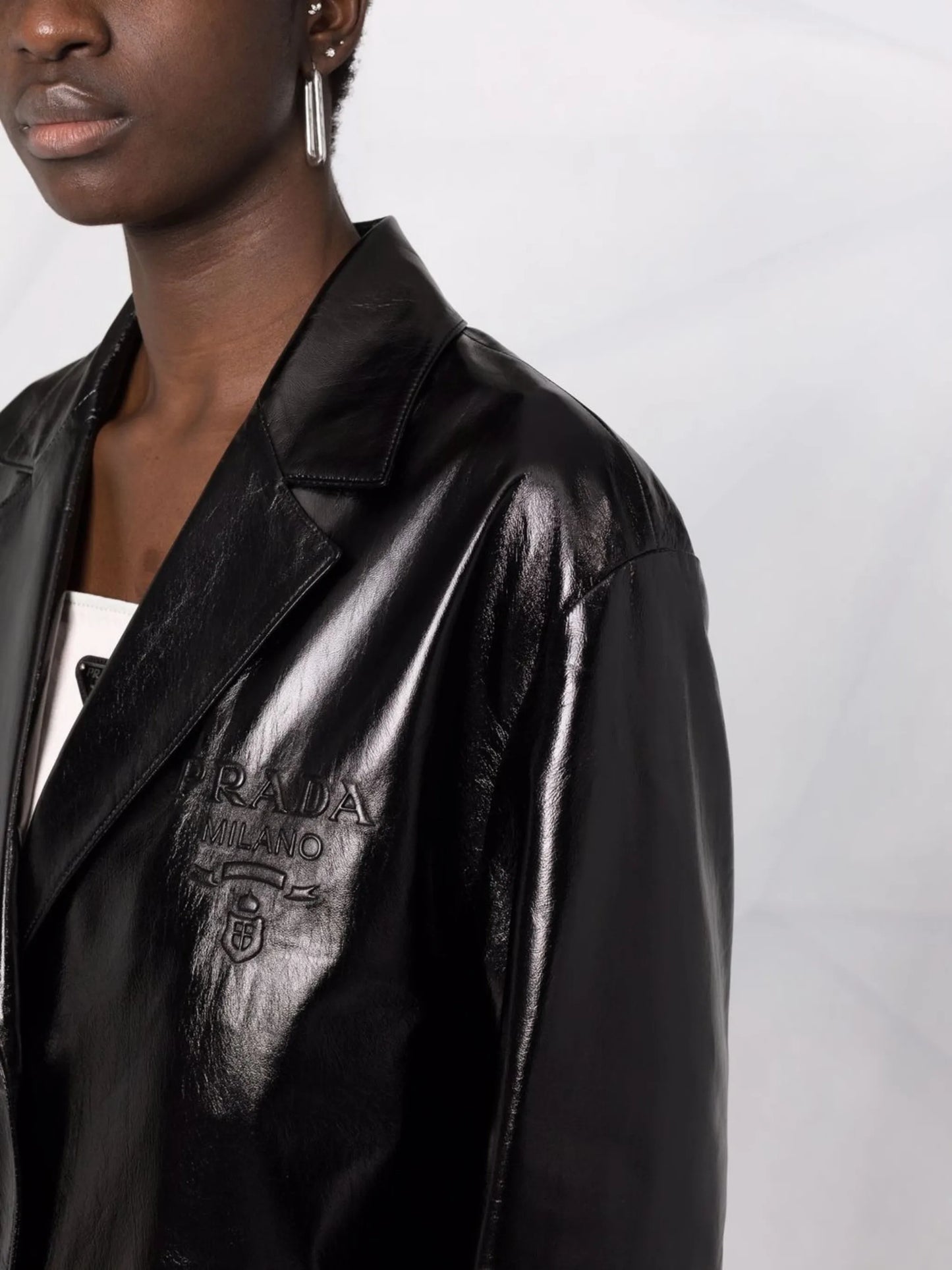 logo embossed leather coat