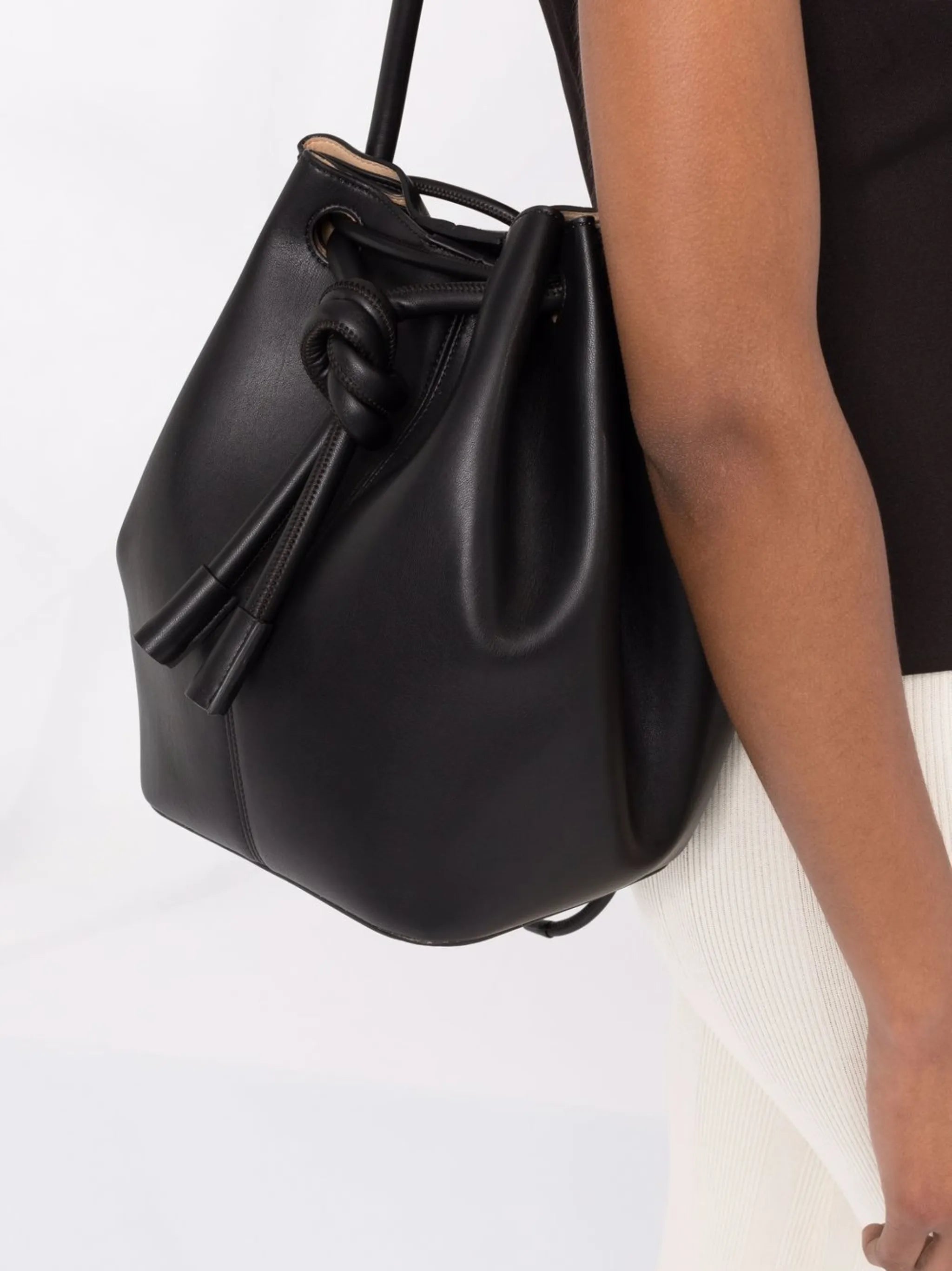 Elongated knot-detail bucket bag