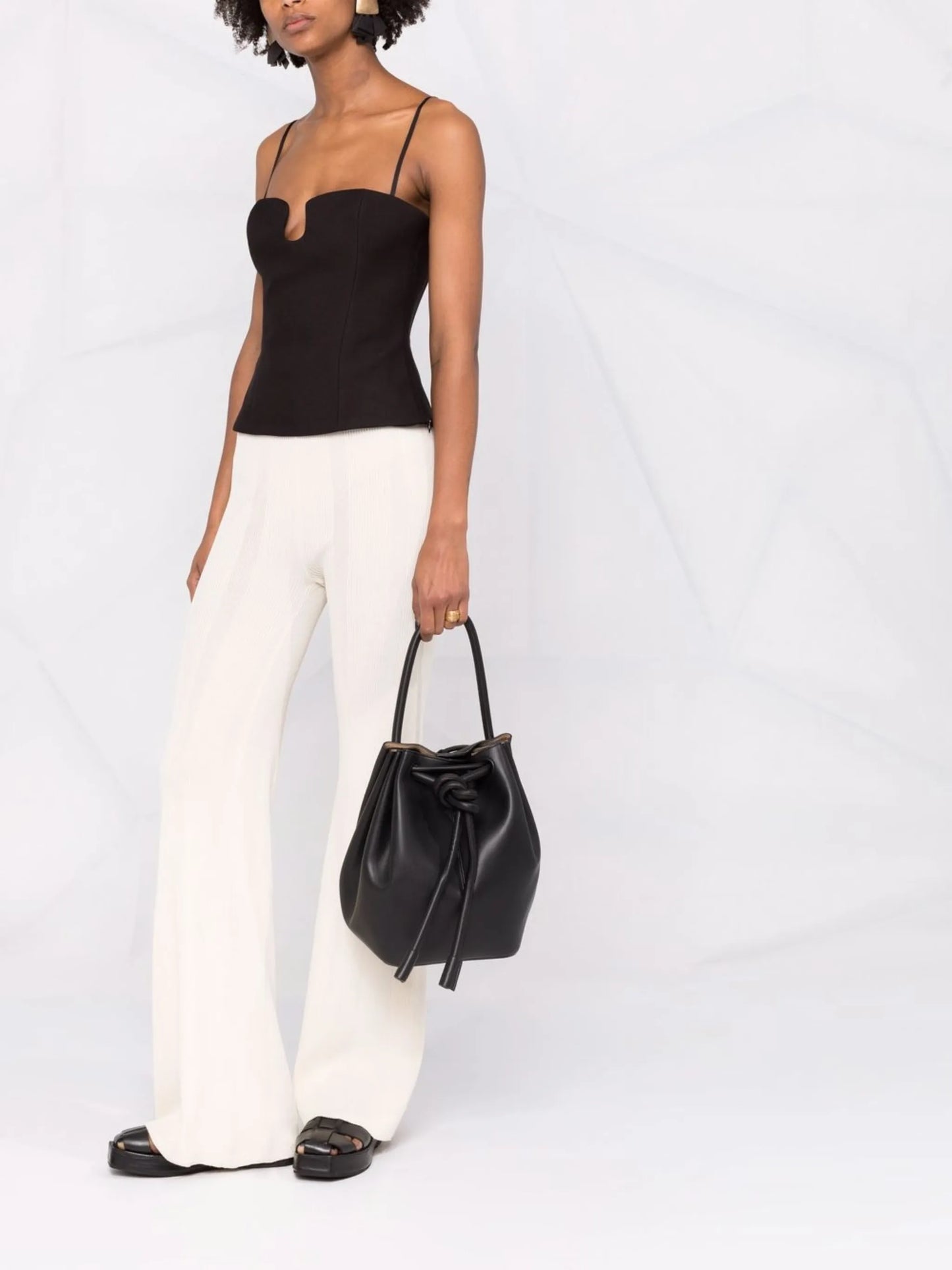 Elongated knot-detail bucket bag