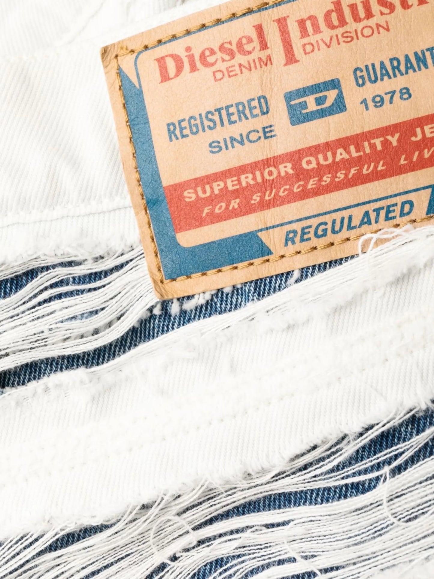 ripped layered straight-leg jeans