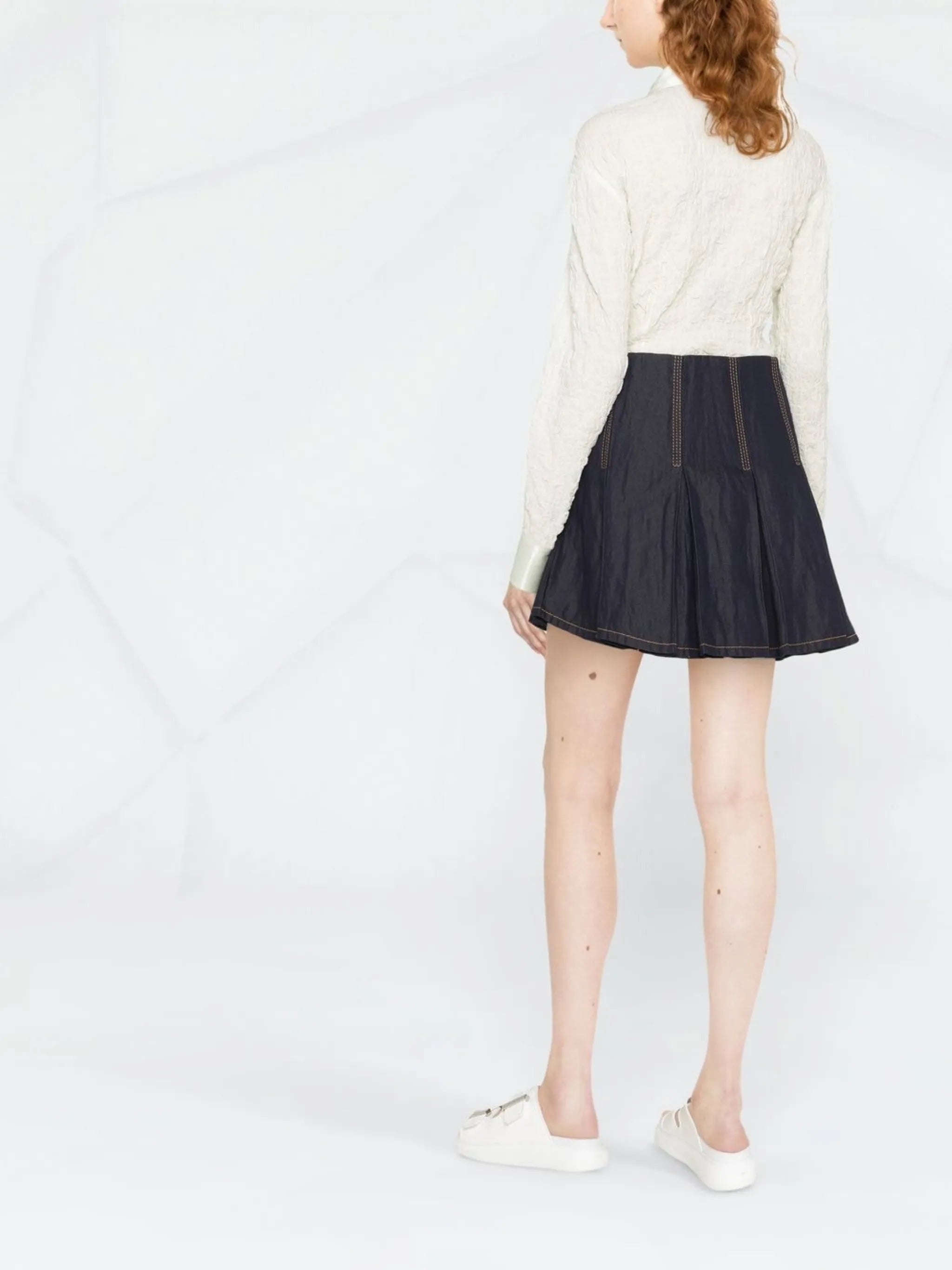 pleated denim mini skirt