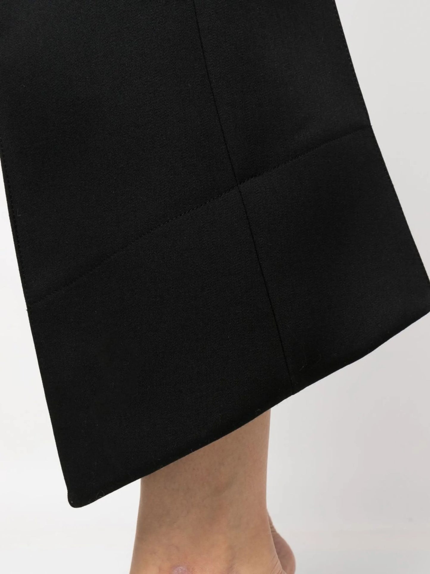 cropped curved seam wool trousers