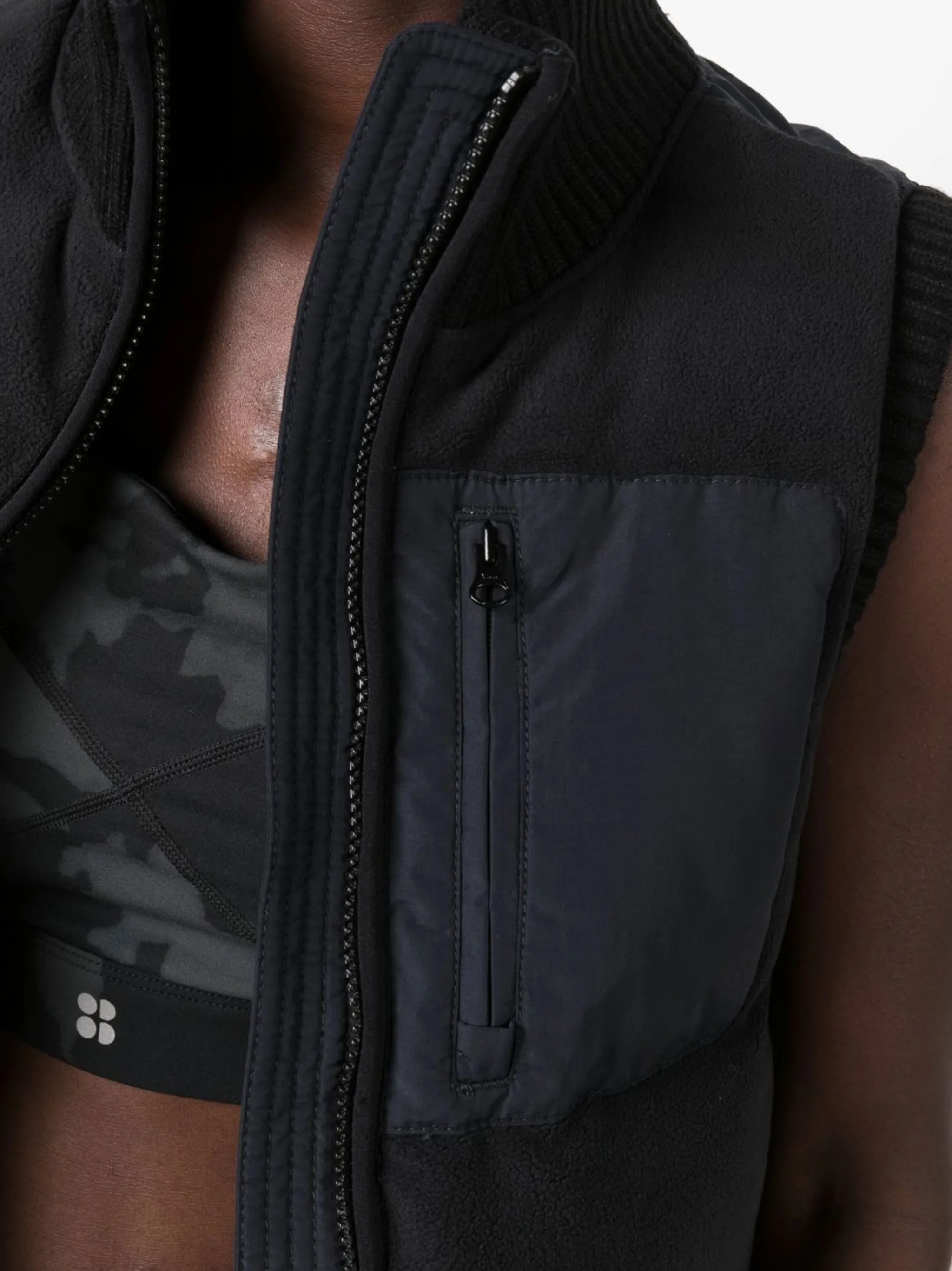 zip-fastening sleeveless jacket