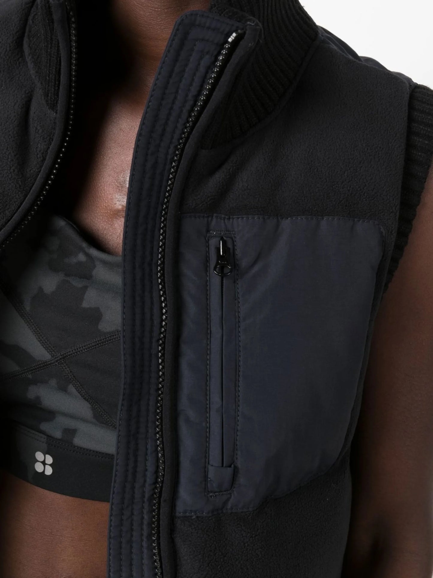 zip-fastening sleeveless jacket