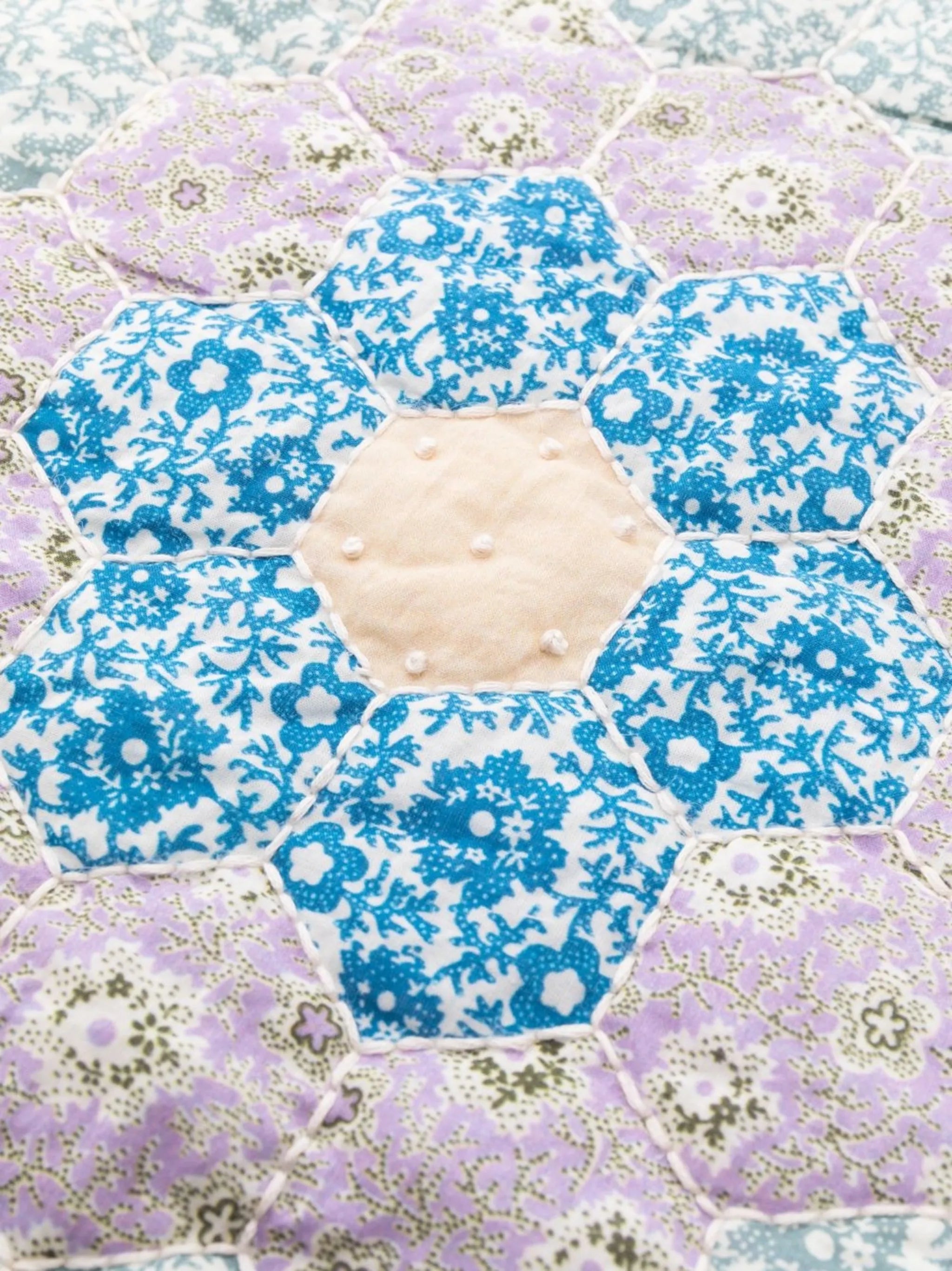 floral-embroidered quilted placemat