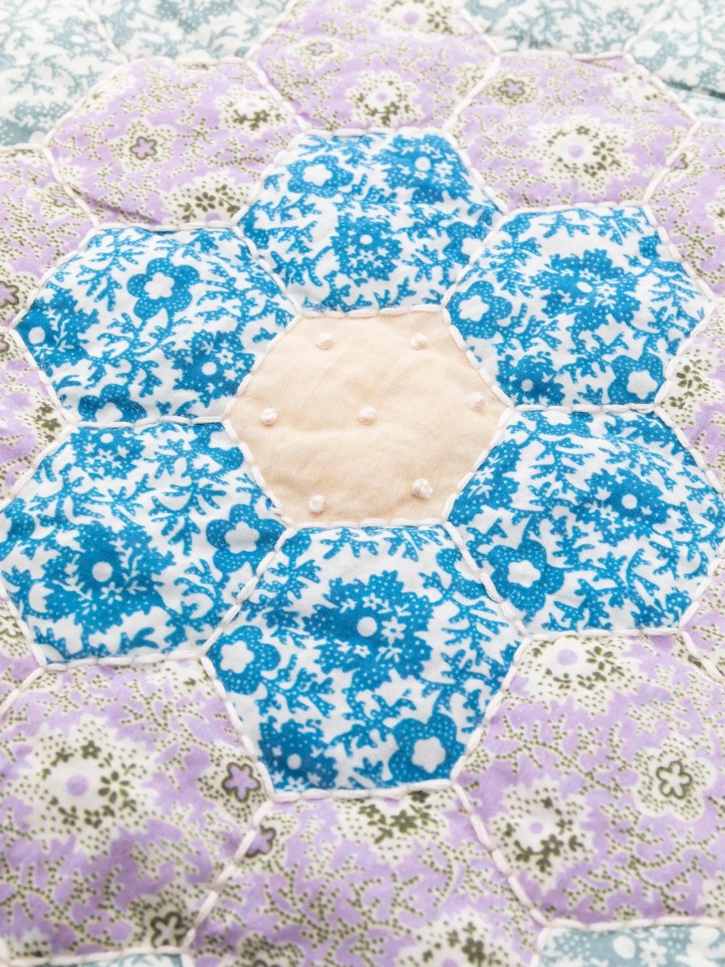 floral-embroidered quilted placemat