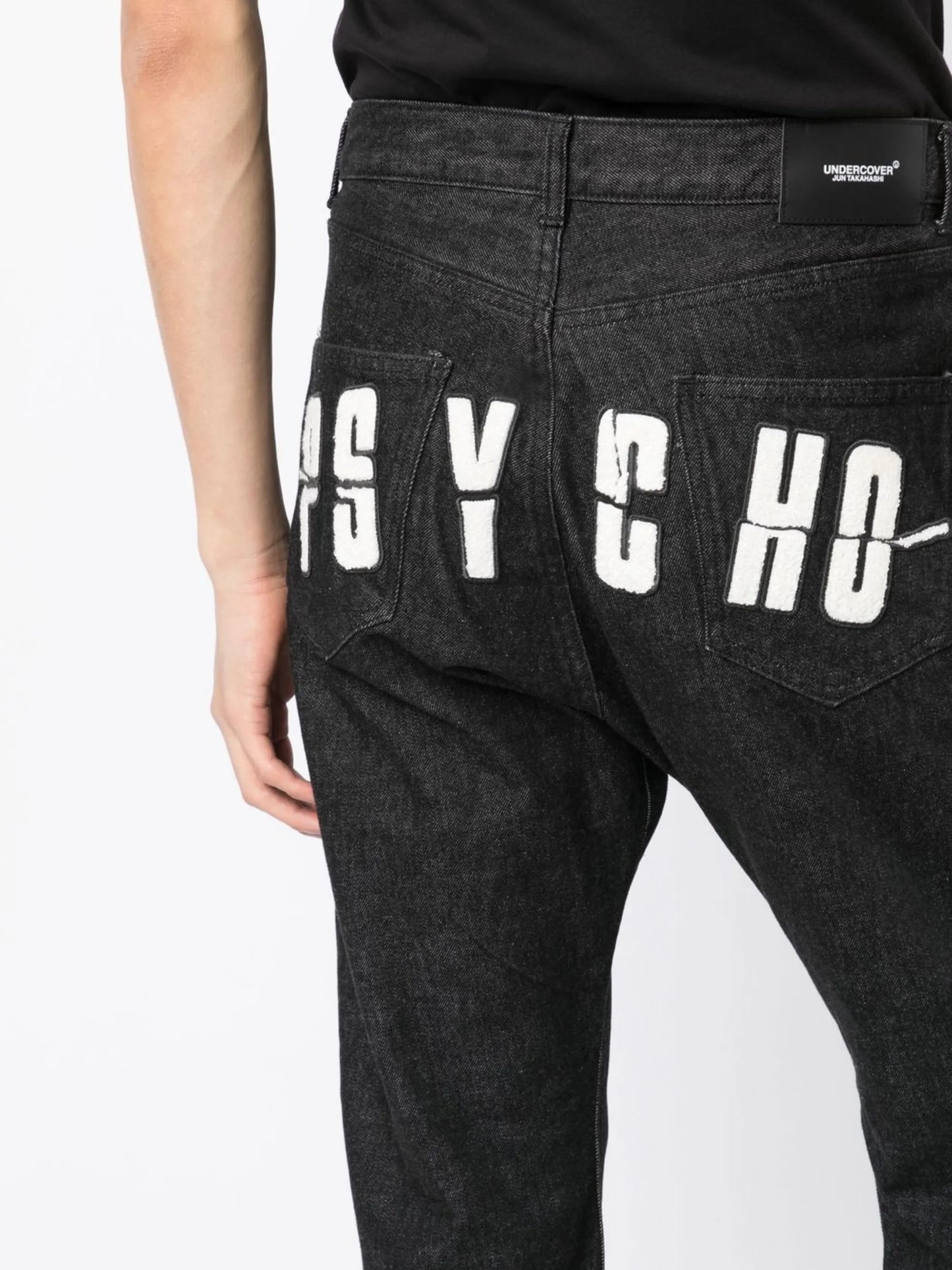 x Psycho logo-appliqué jeans
