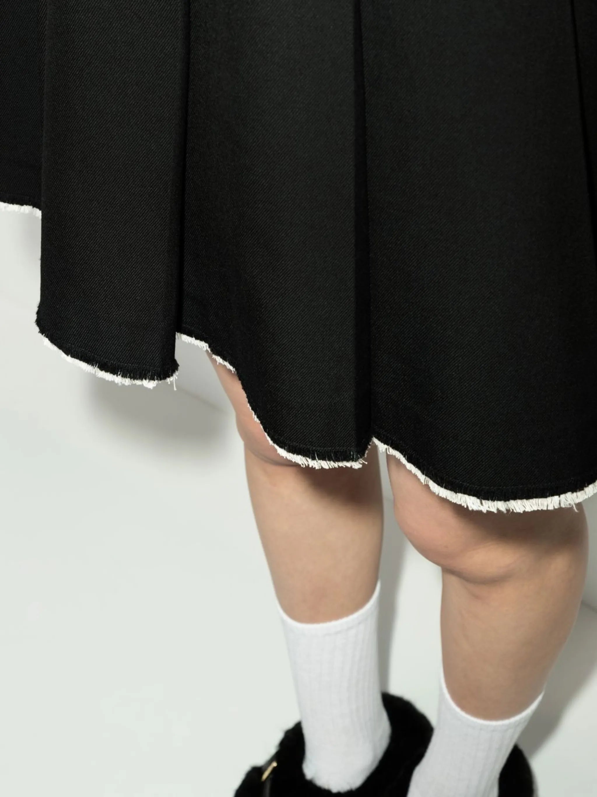 pleated raw-hem skirt