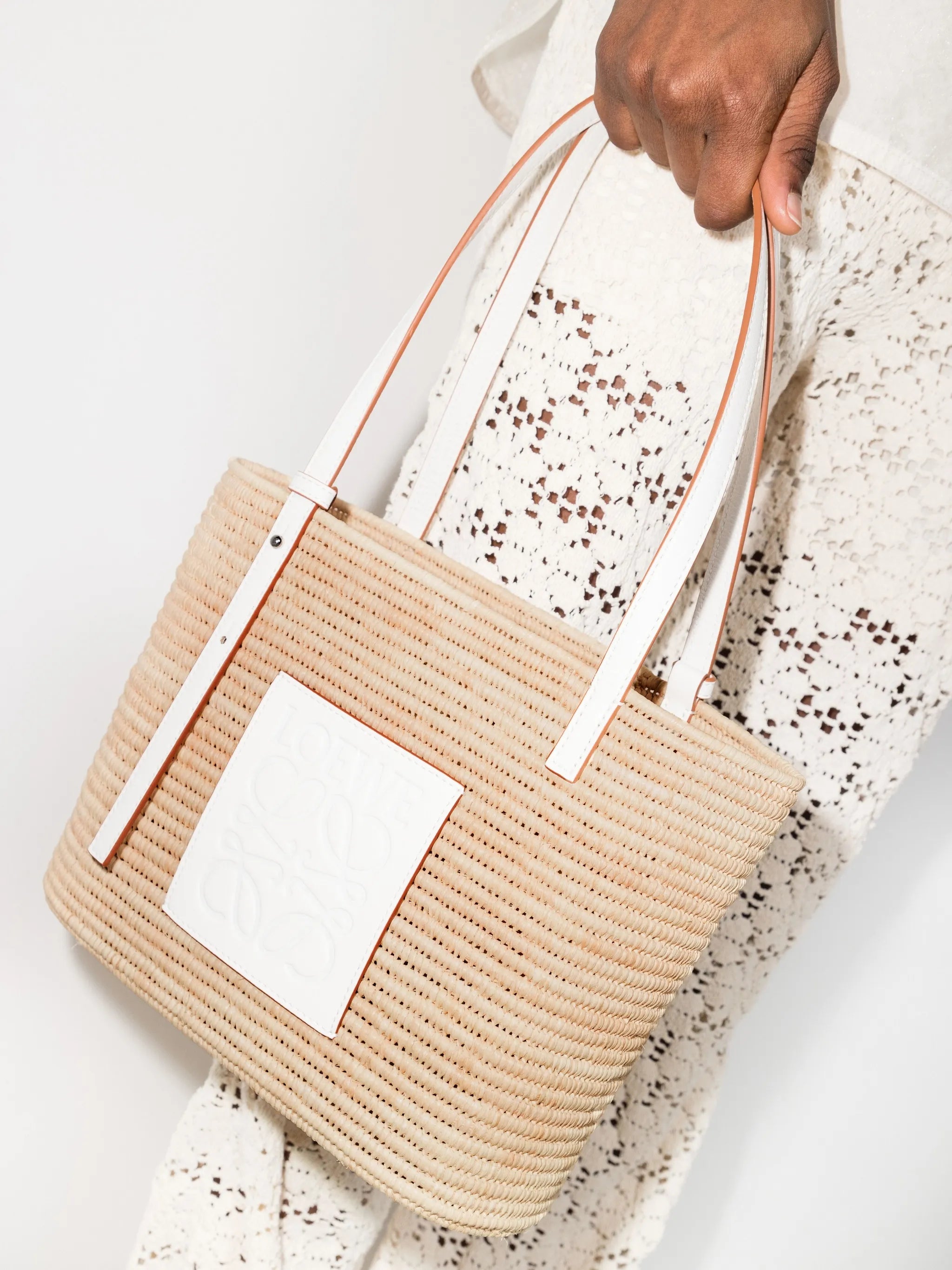 Anagram-patch raffia tote bag