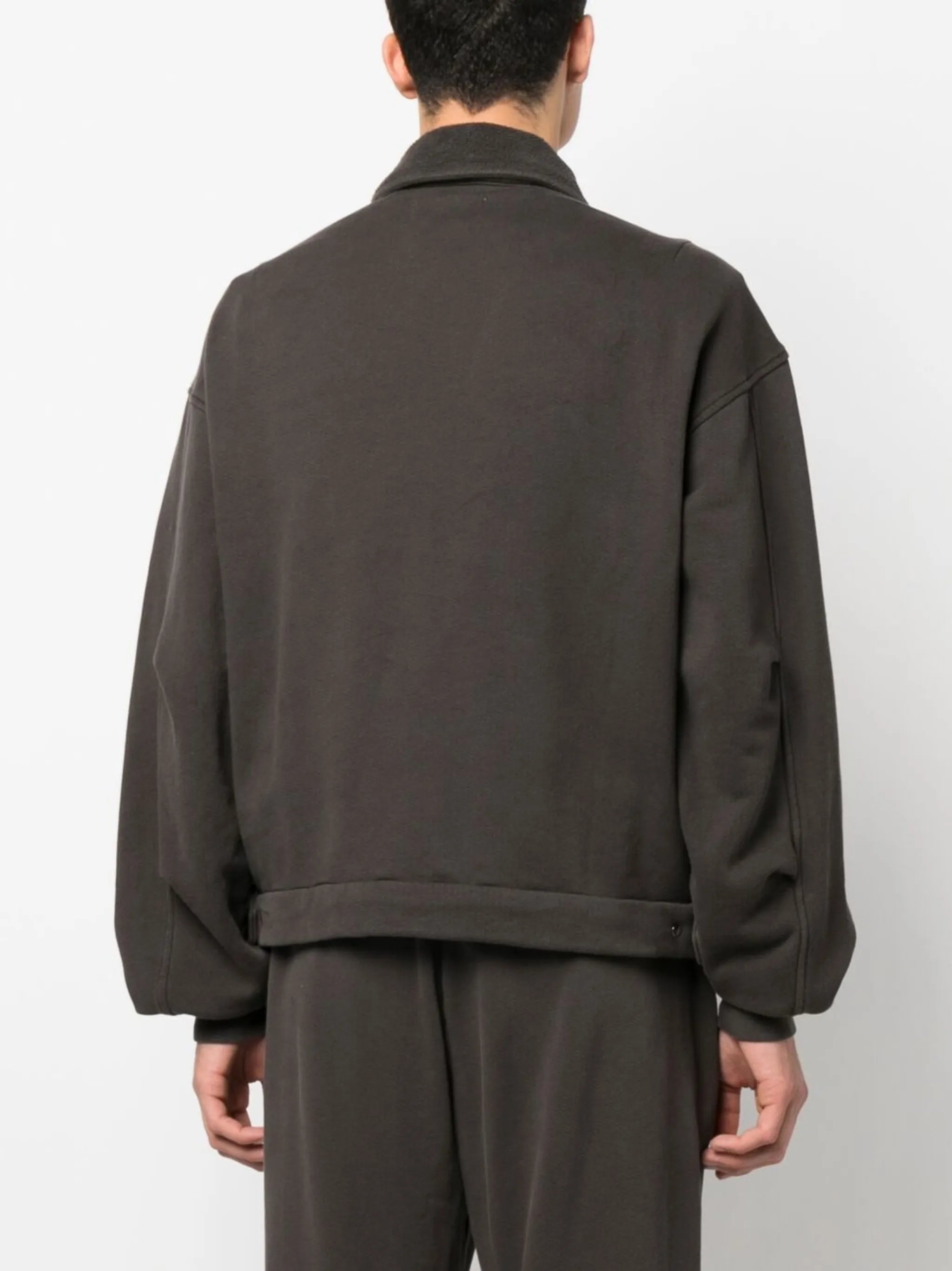zipped-up sweat jacket