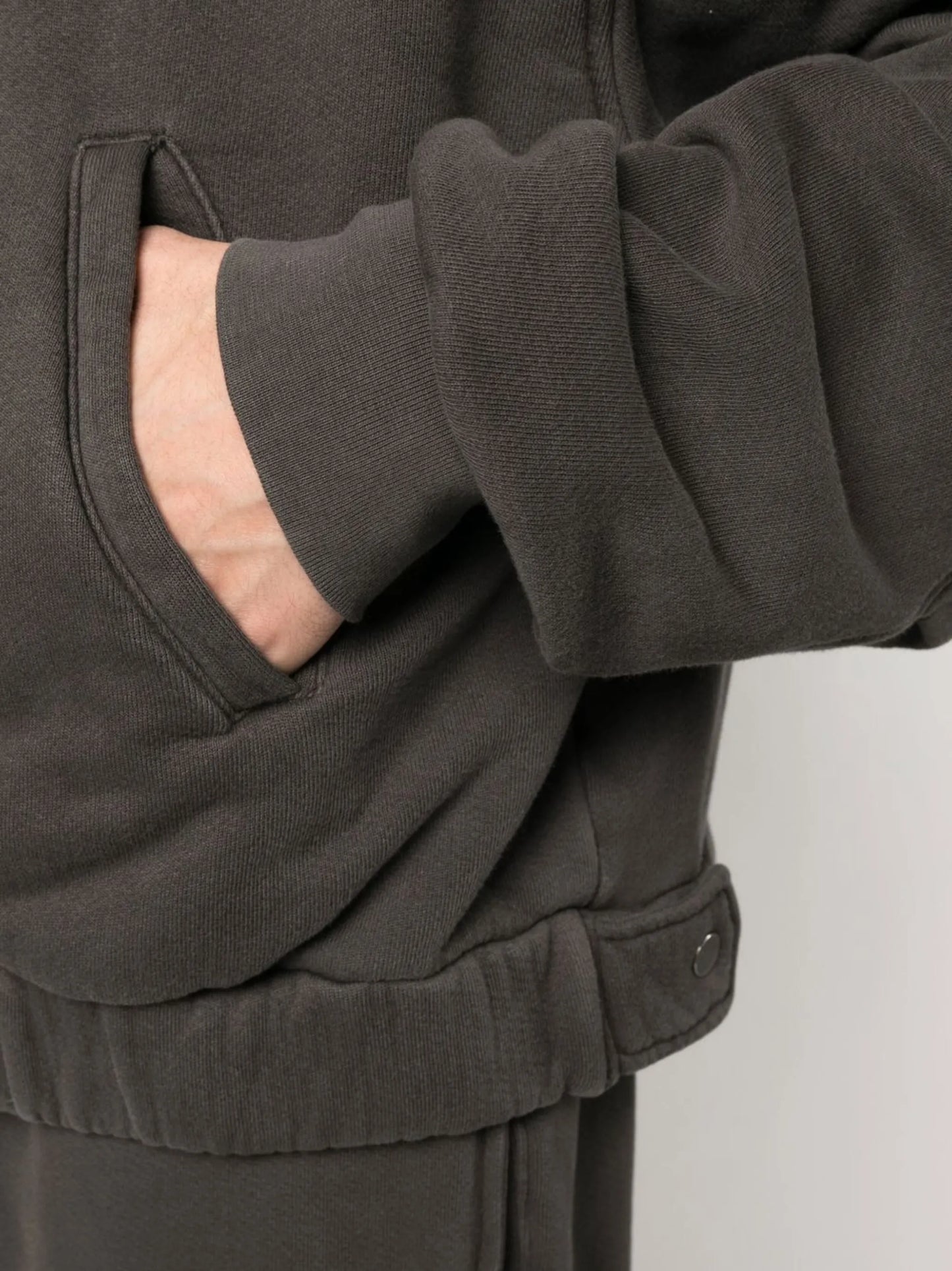 zipped-up sweat jacket