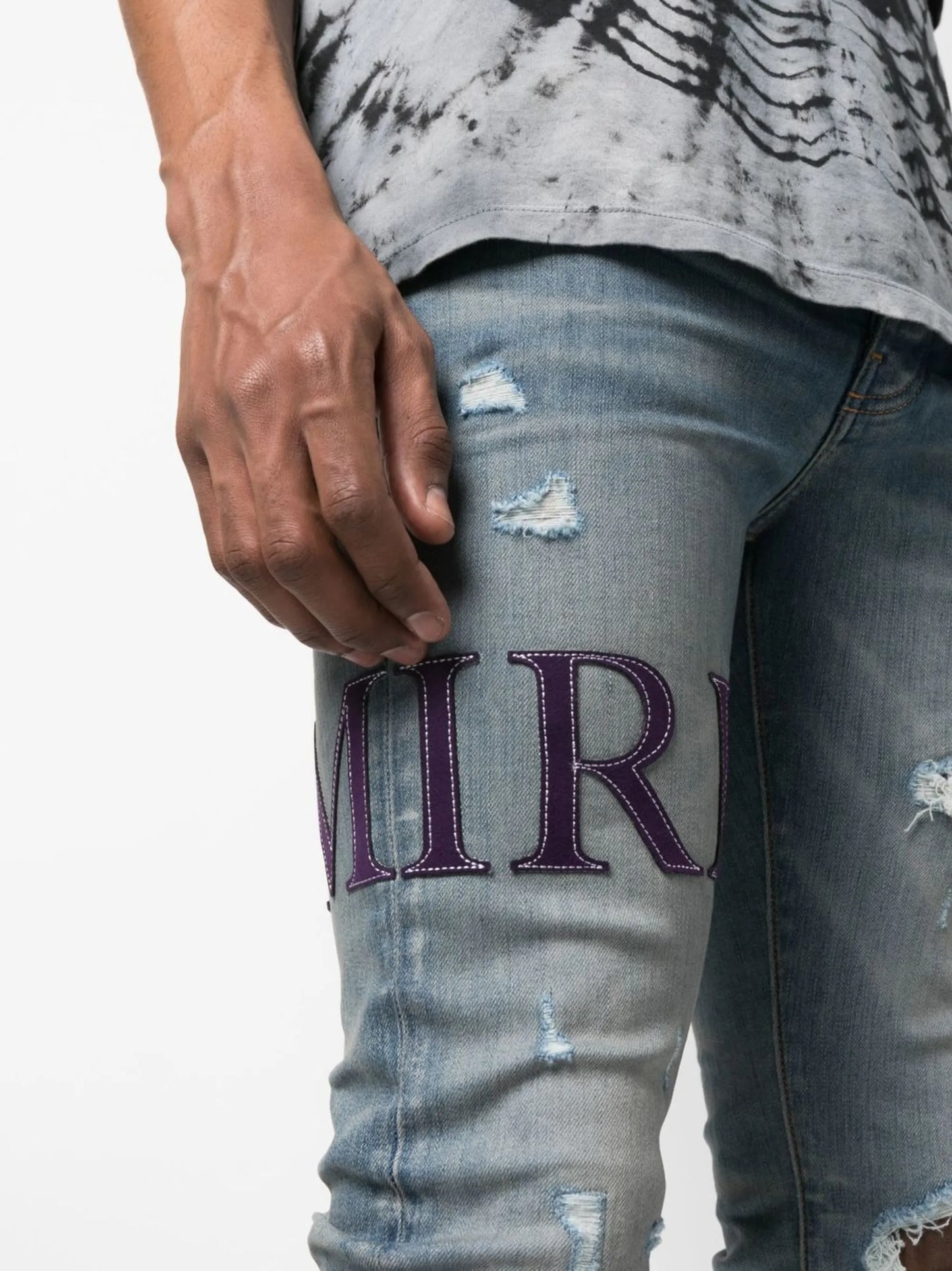 ripped-knee logo-print skinny jeans