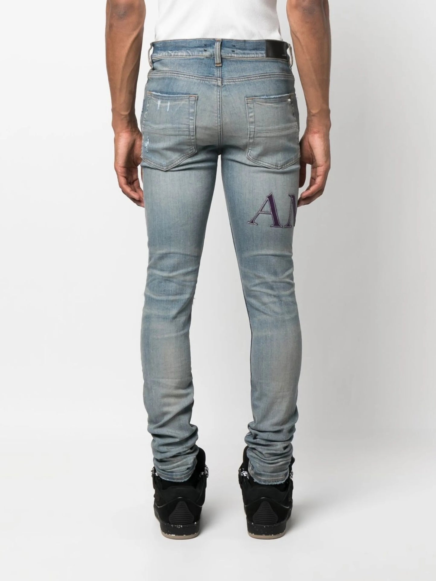 ripped-knee logo-print skinny jeans