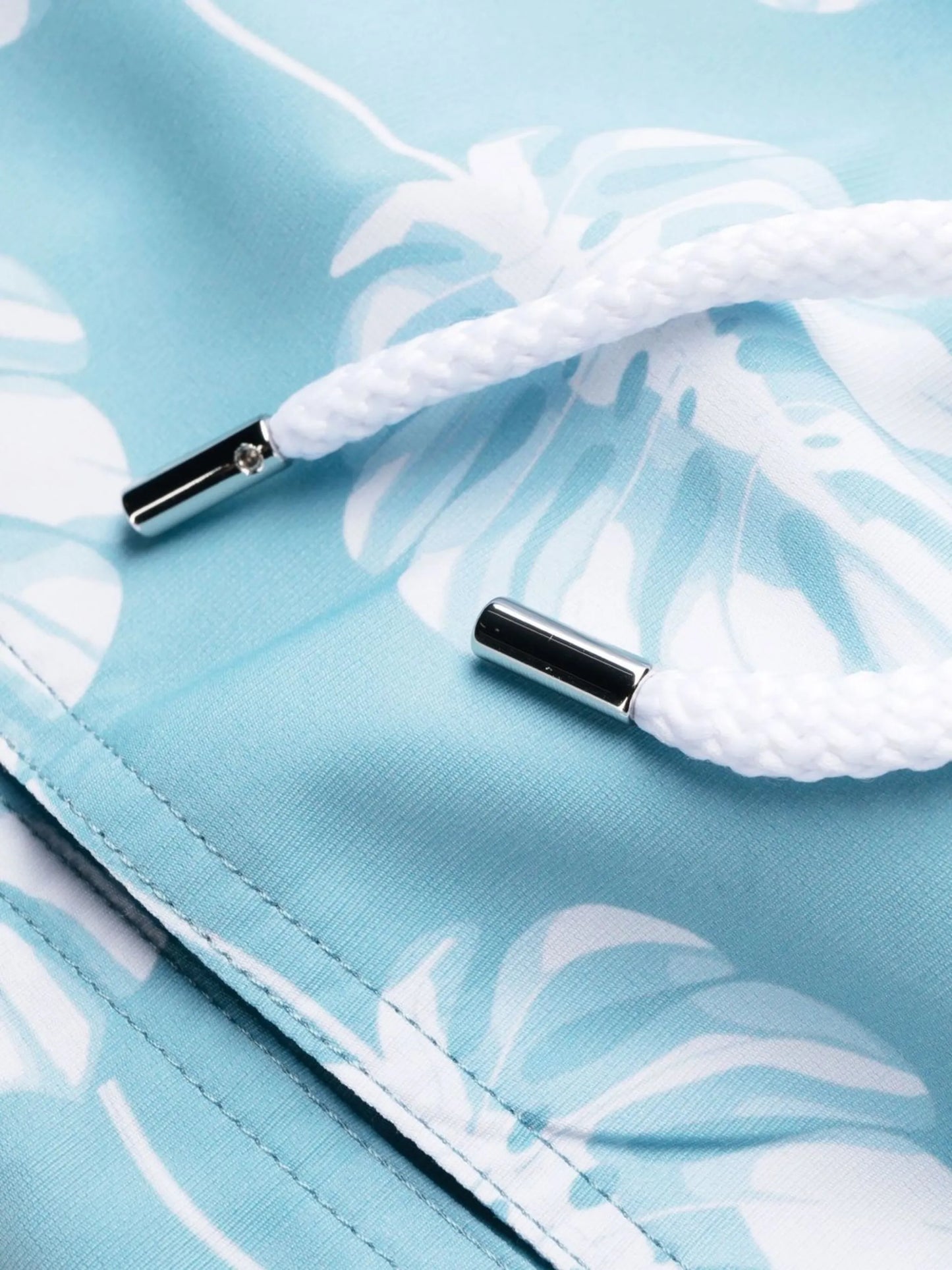 leaf-print swim shorts