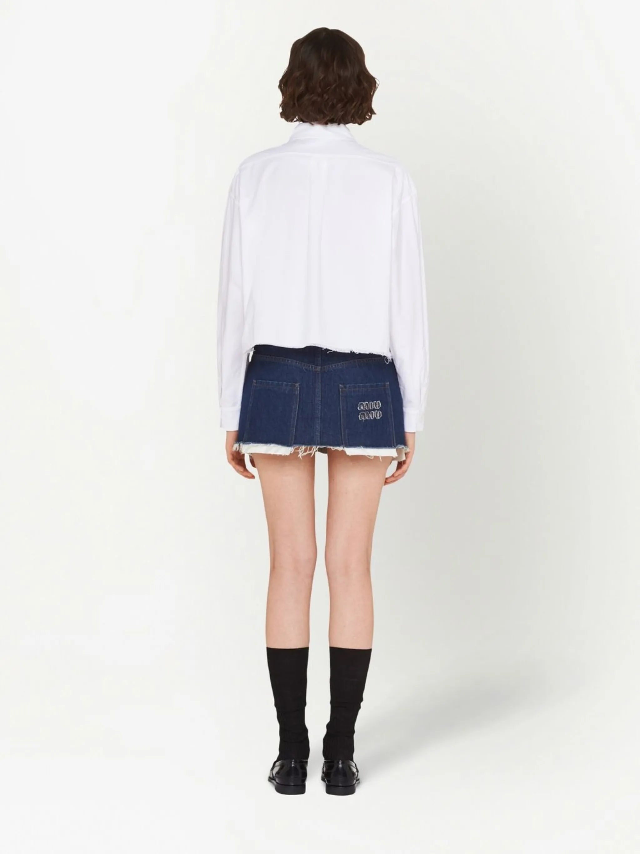 raw-cut denim mini skirt