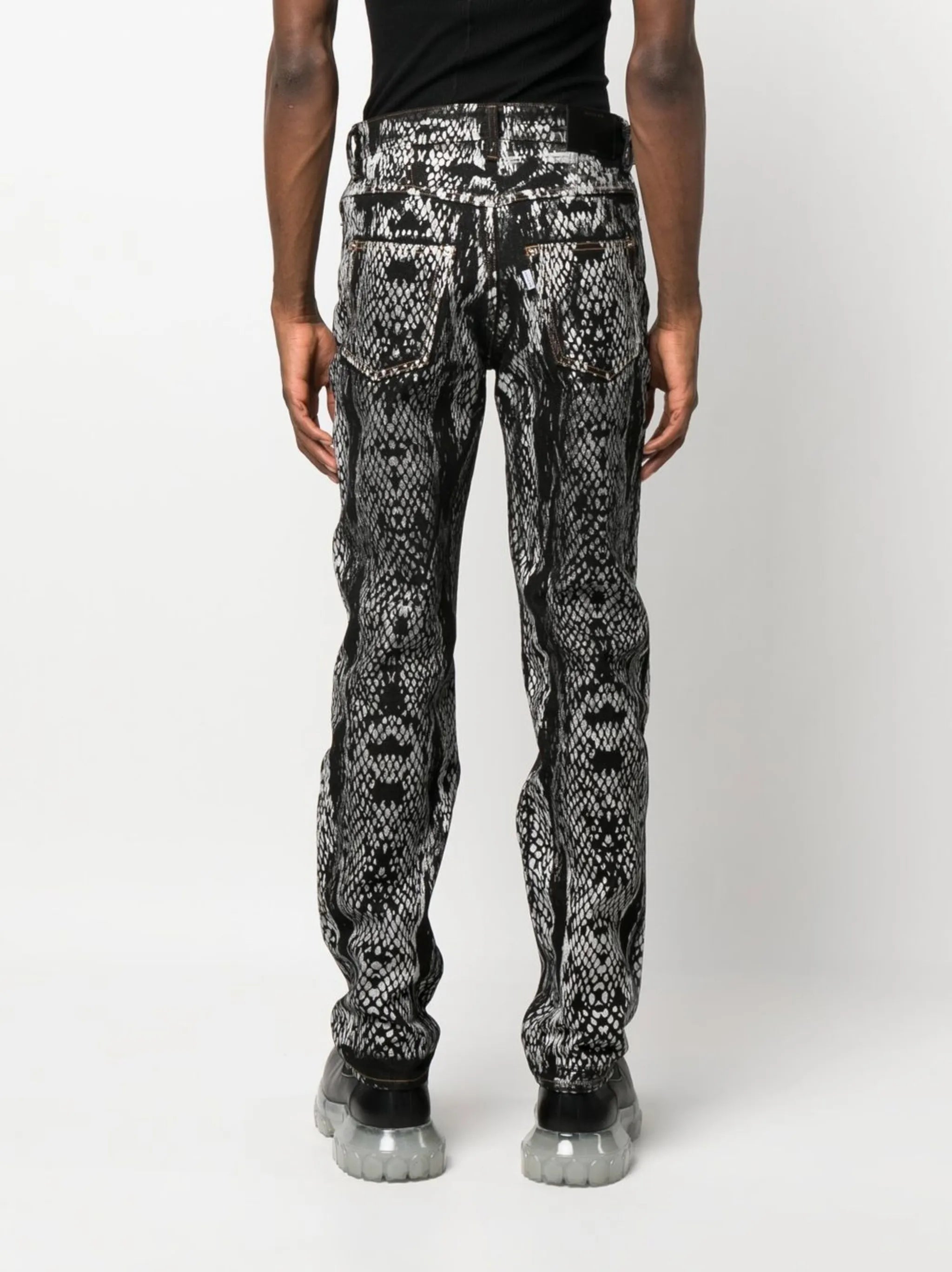 snakeskin-print denim trousers