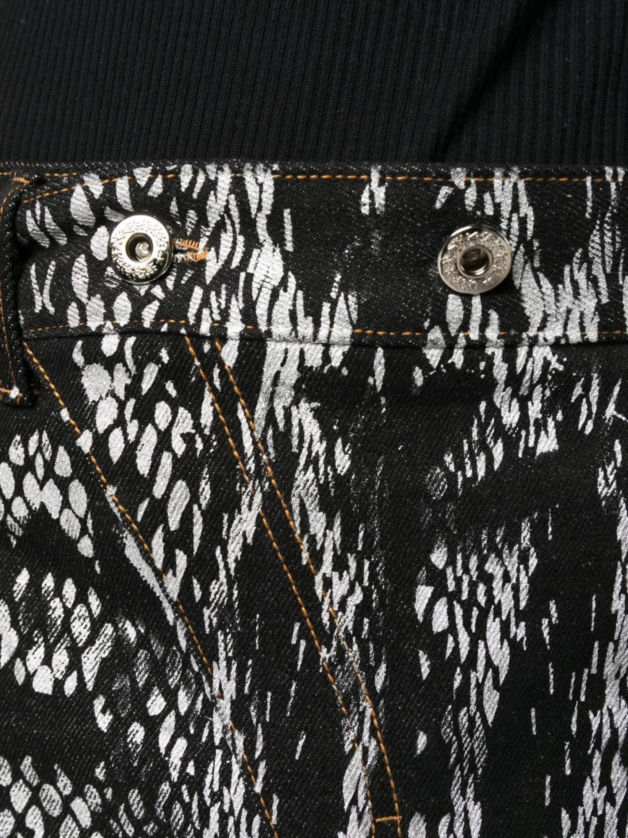 snakeskin-print denim trousers