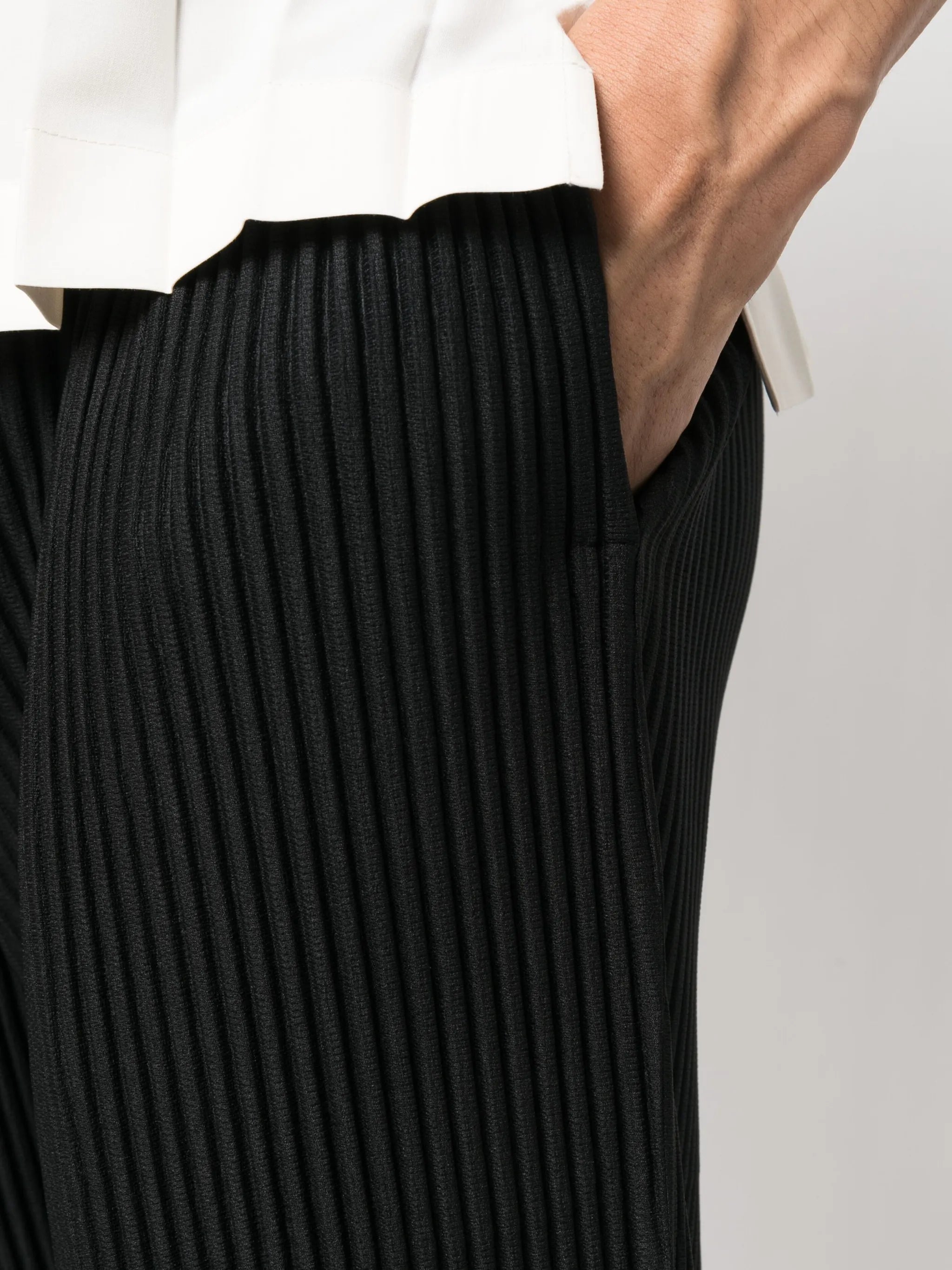 fully-pleated tapered-leg trousers