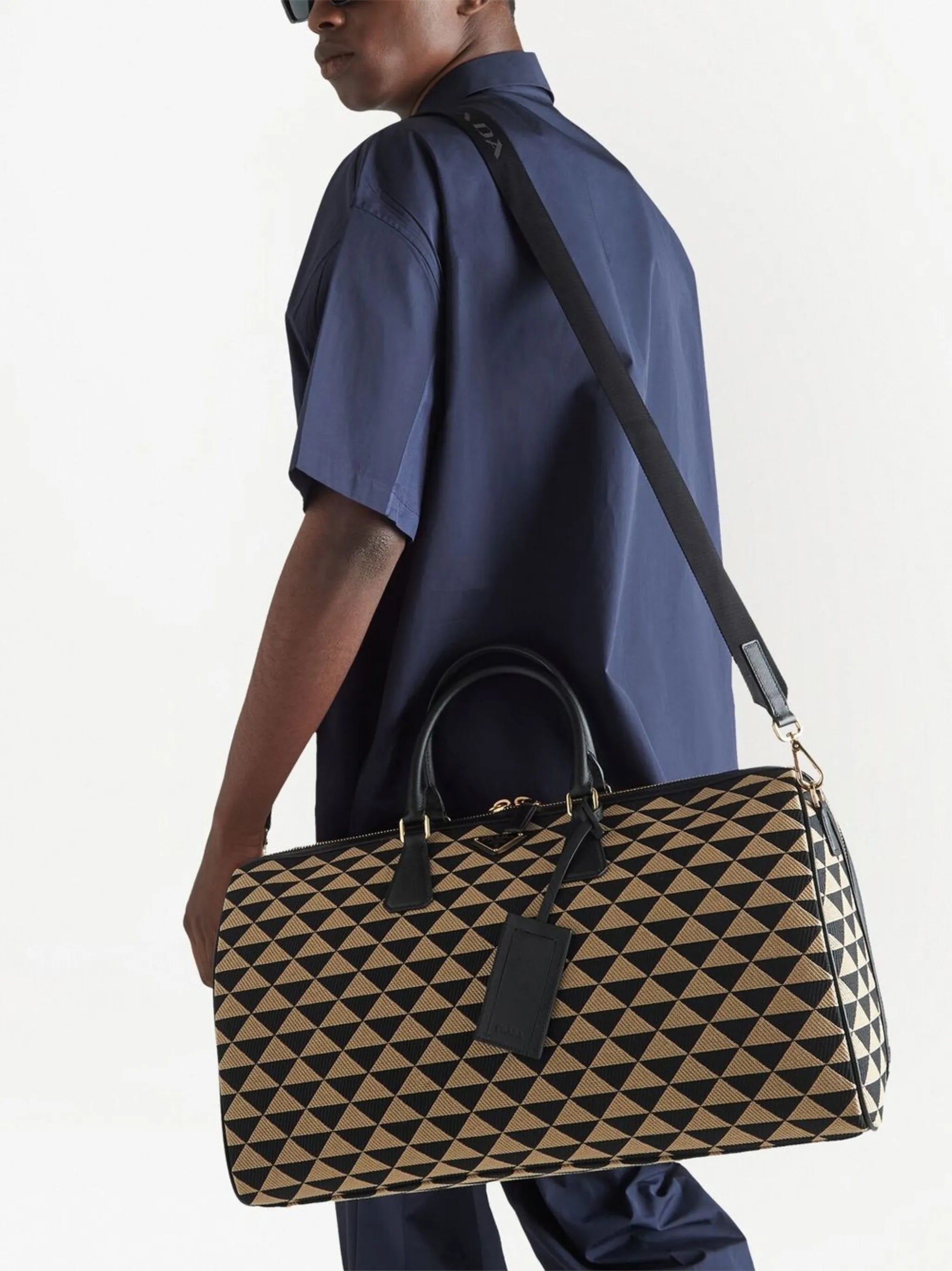 Symbole embroidered fabric travel bag