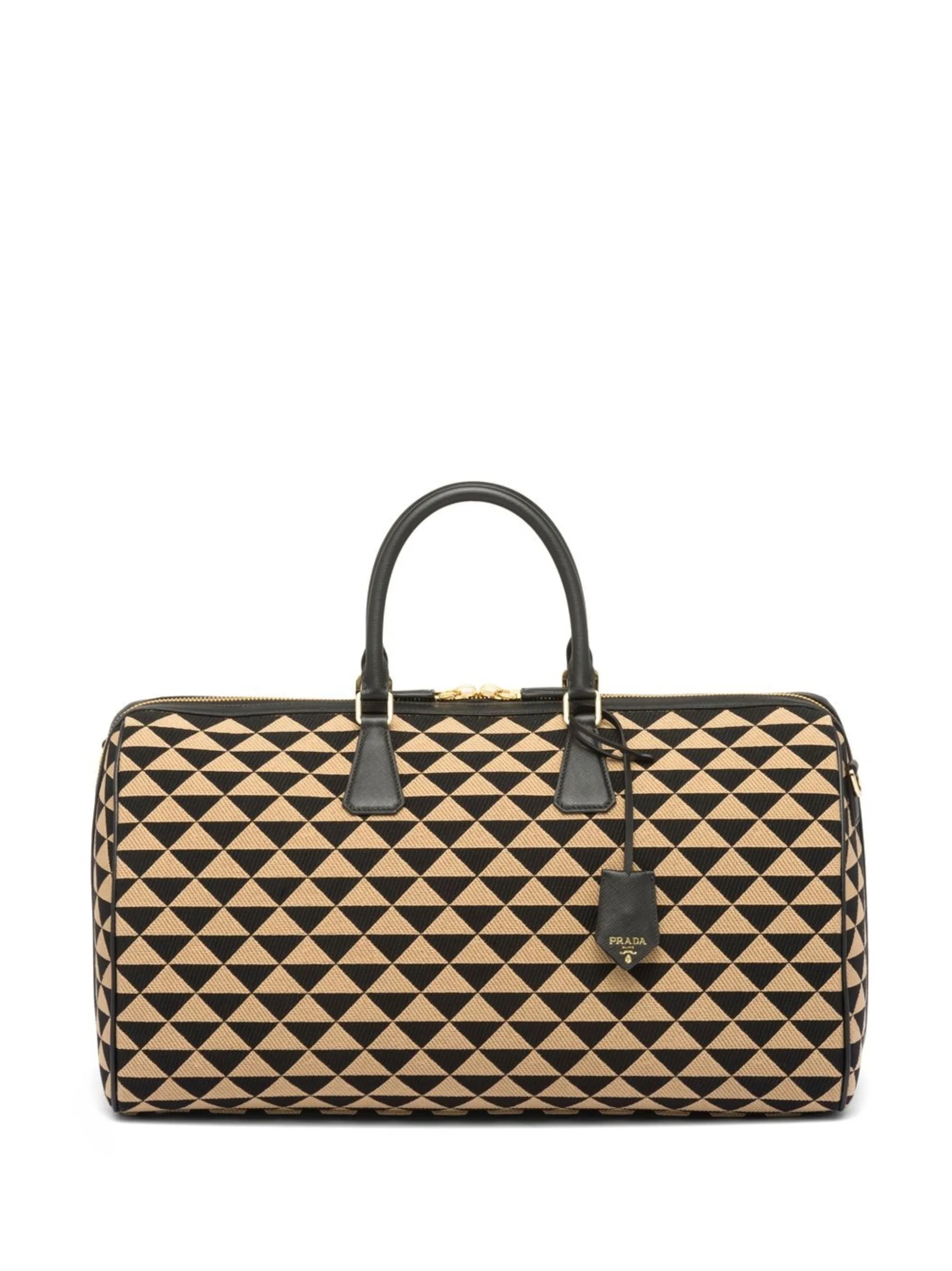 Symbole embroidered fabric travel bag