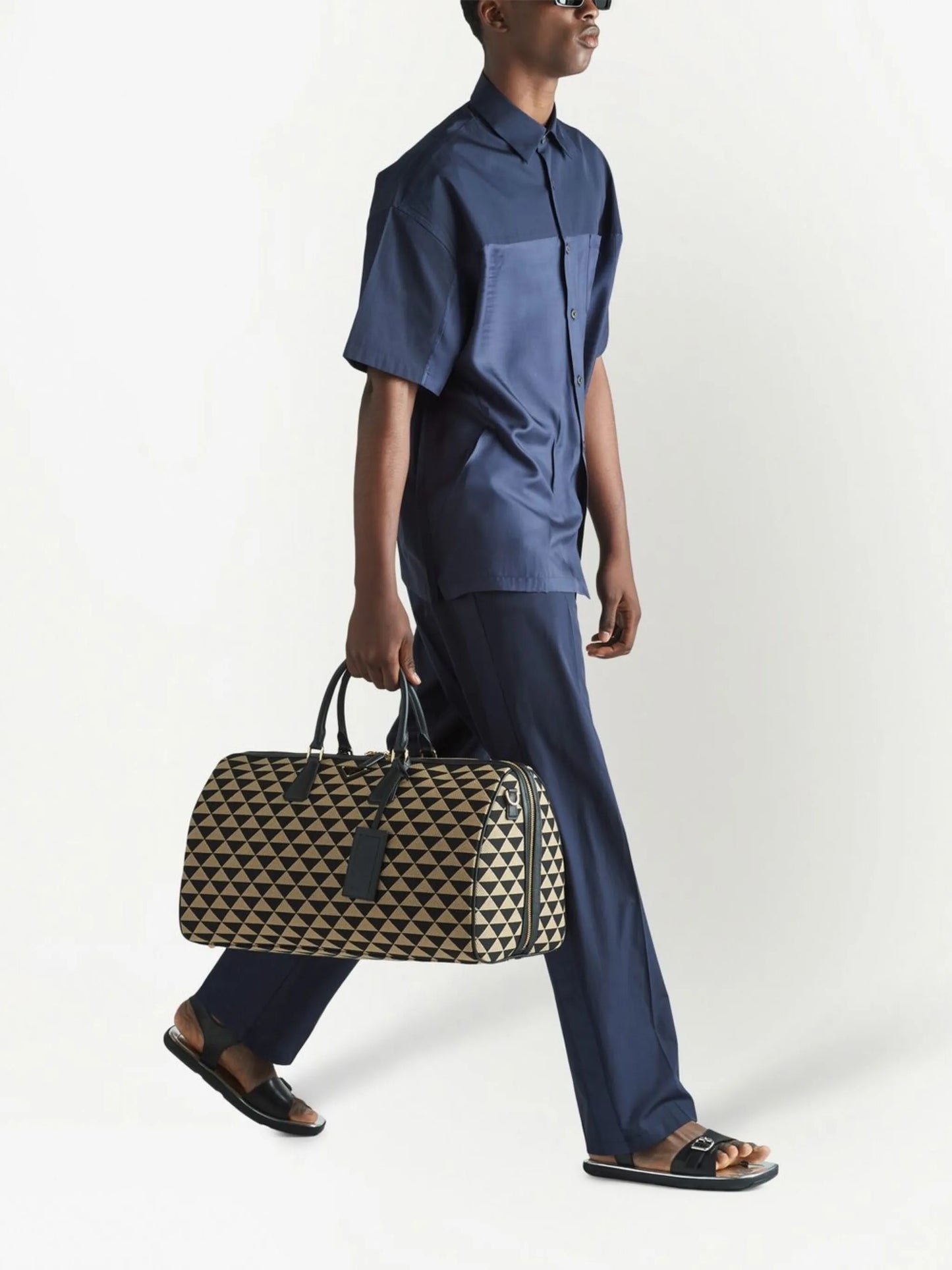 Symbole embroidered fabric travel bag