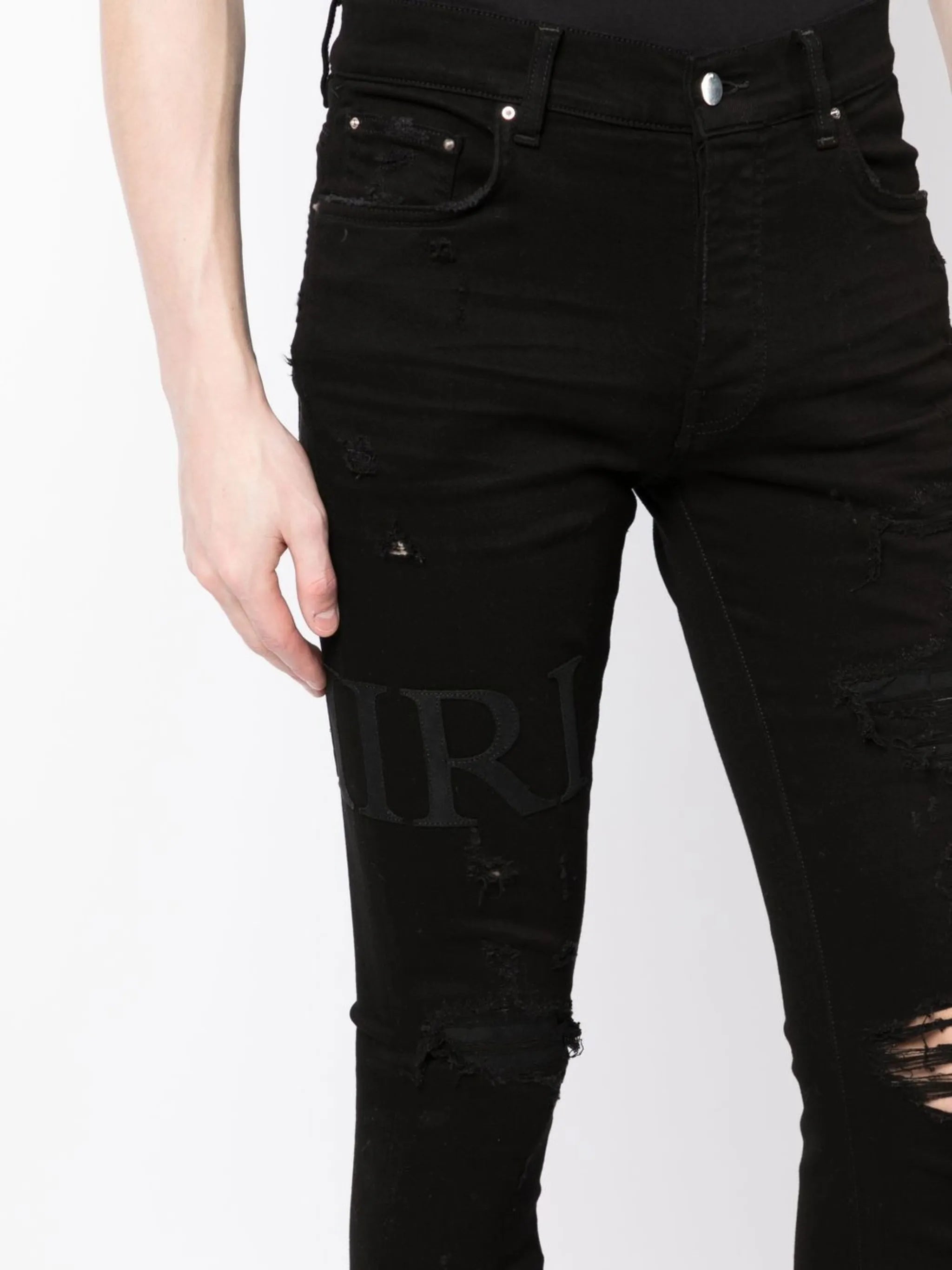 ripped-knee logo-print skinny jeans