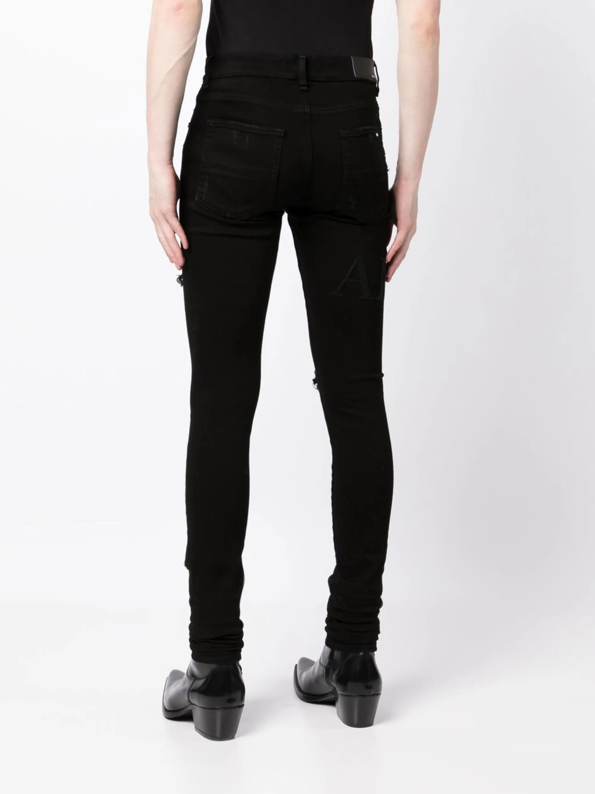 ripped-knee logo-print skinny jeans