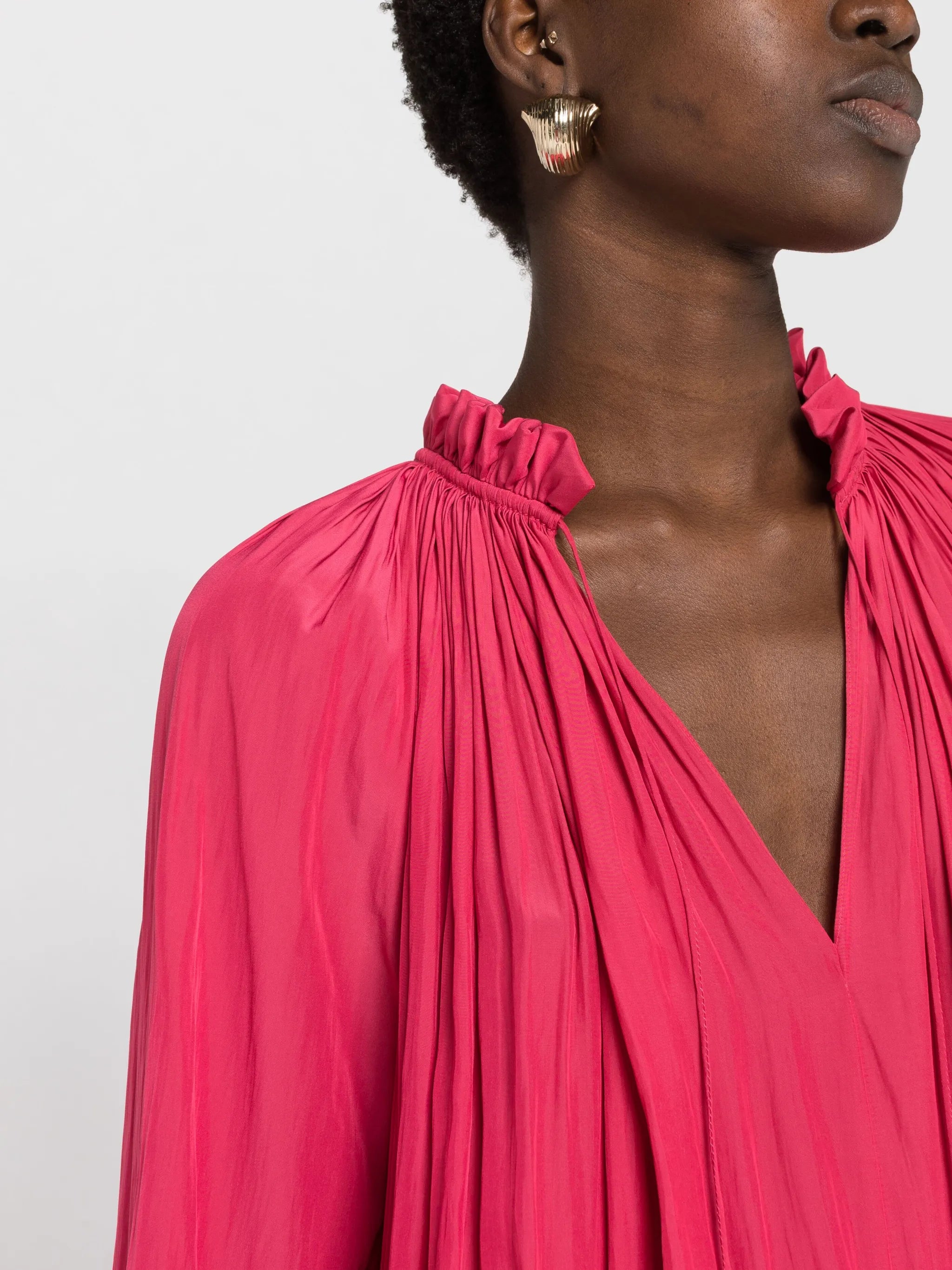 gathered-neck ruffled-hem blouse