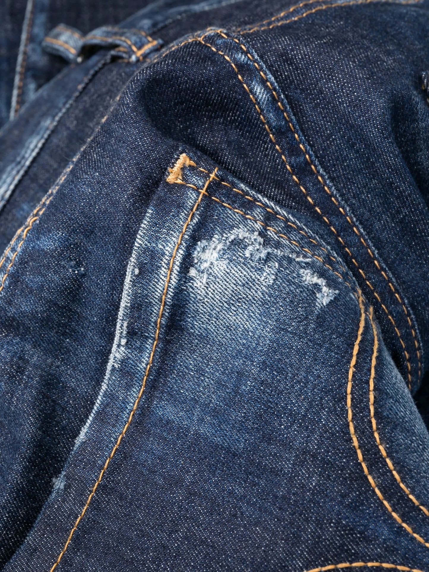 distressed-finish tapered-leg jeans