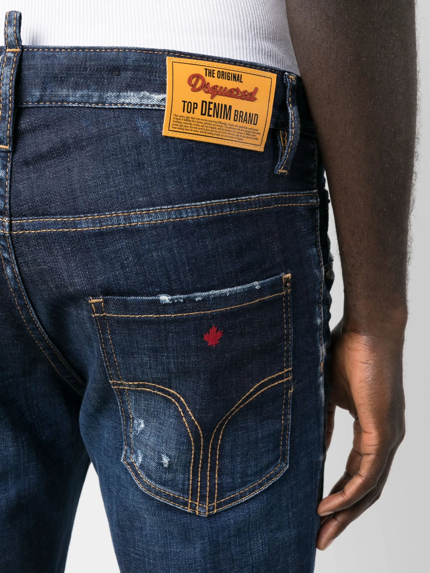 distressed-finish tapered-leg jeans