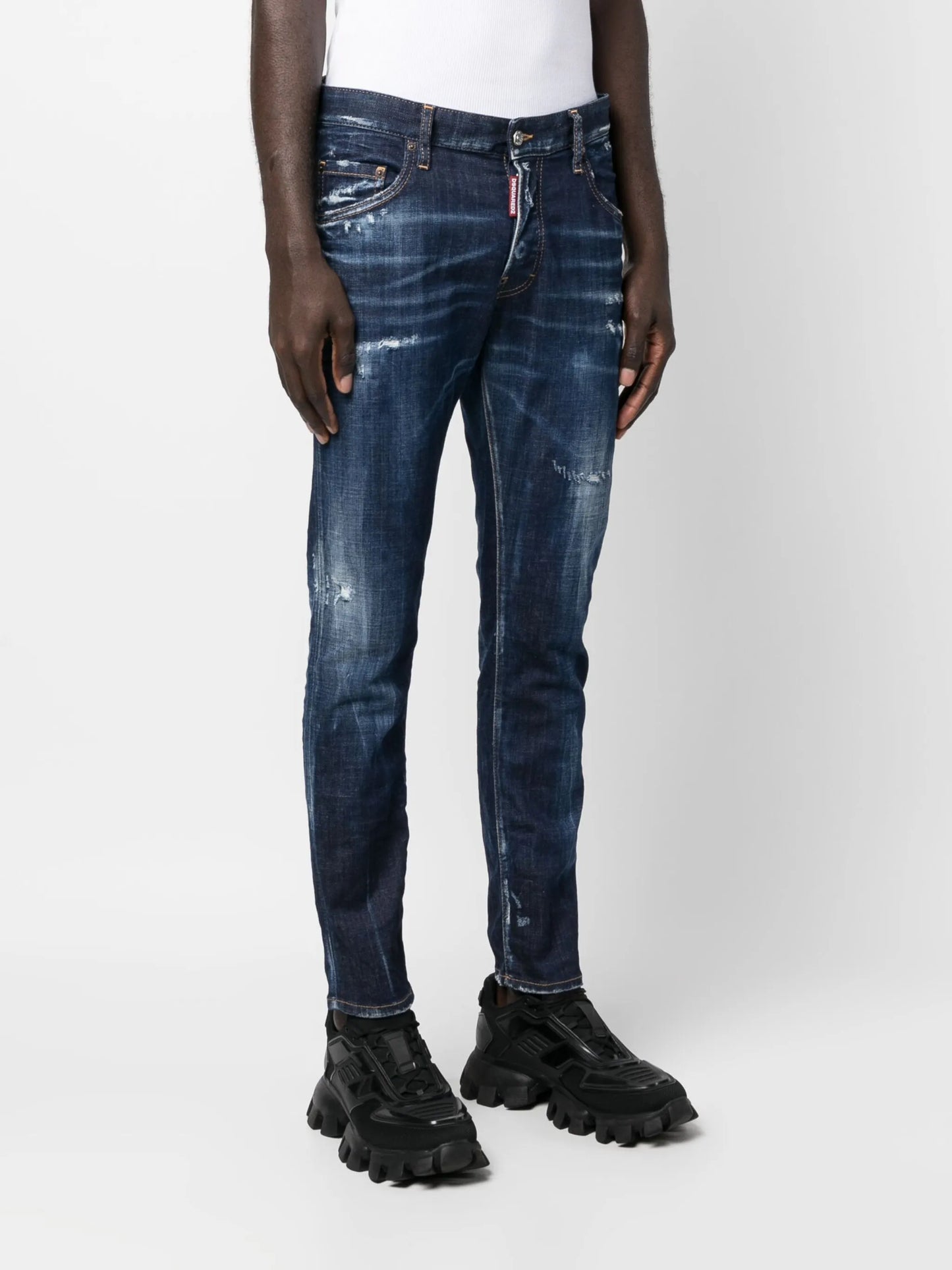 distressed-finish tapered-leg jeans