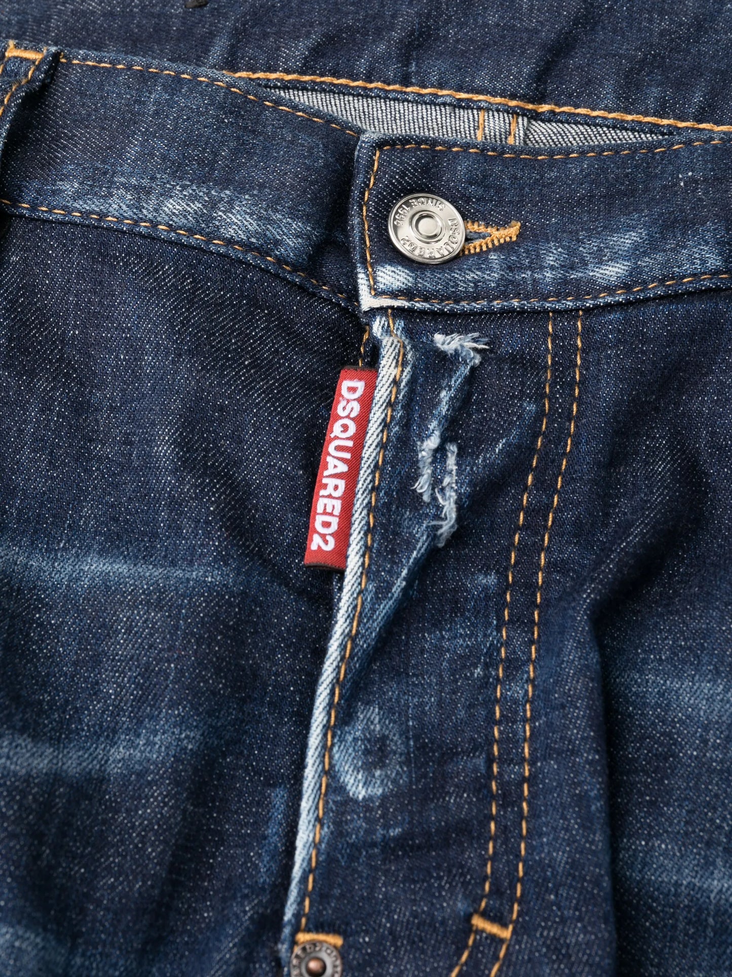 distressed-finish tapered-leg jeans