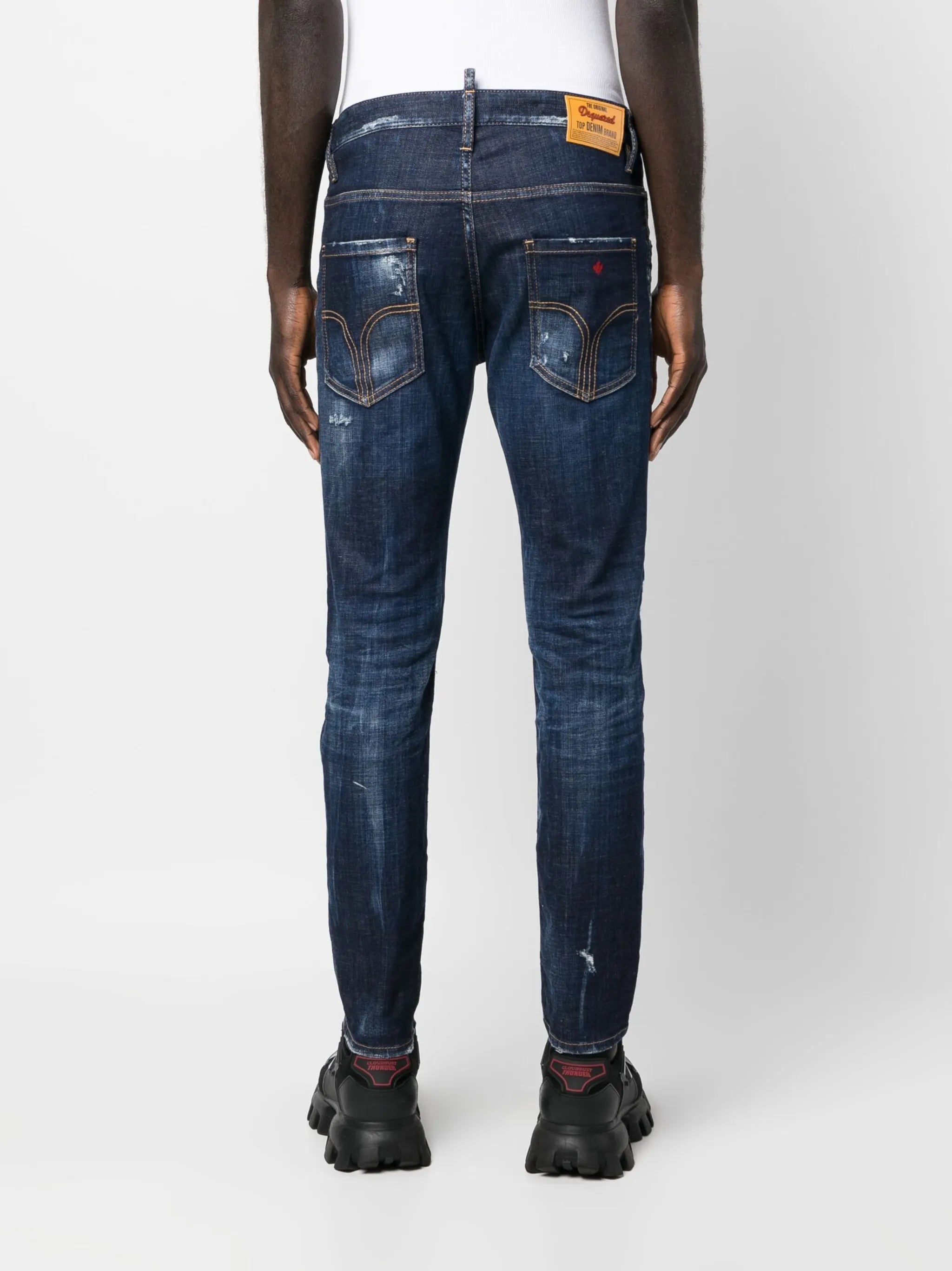 distressed-finish tapered-leg jeans