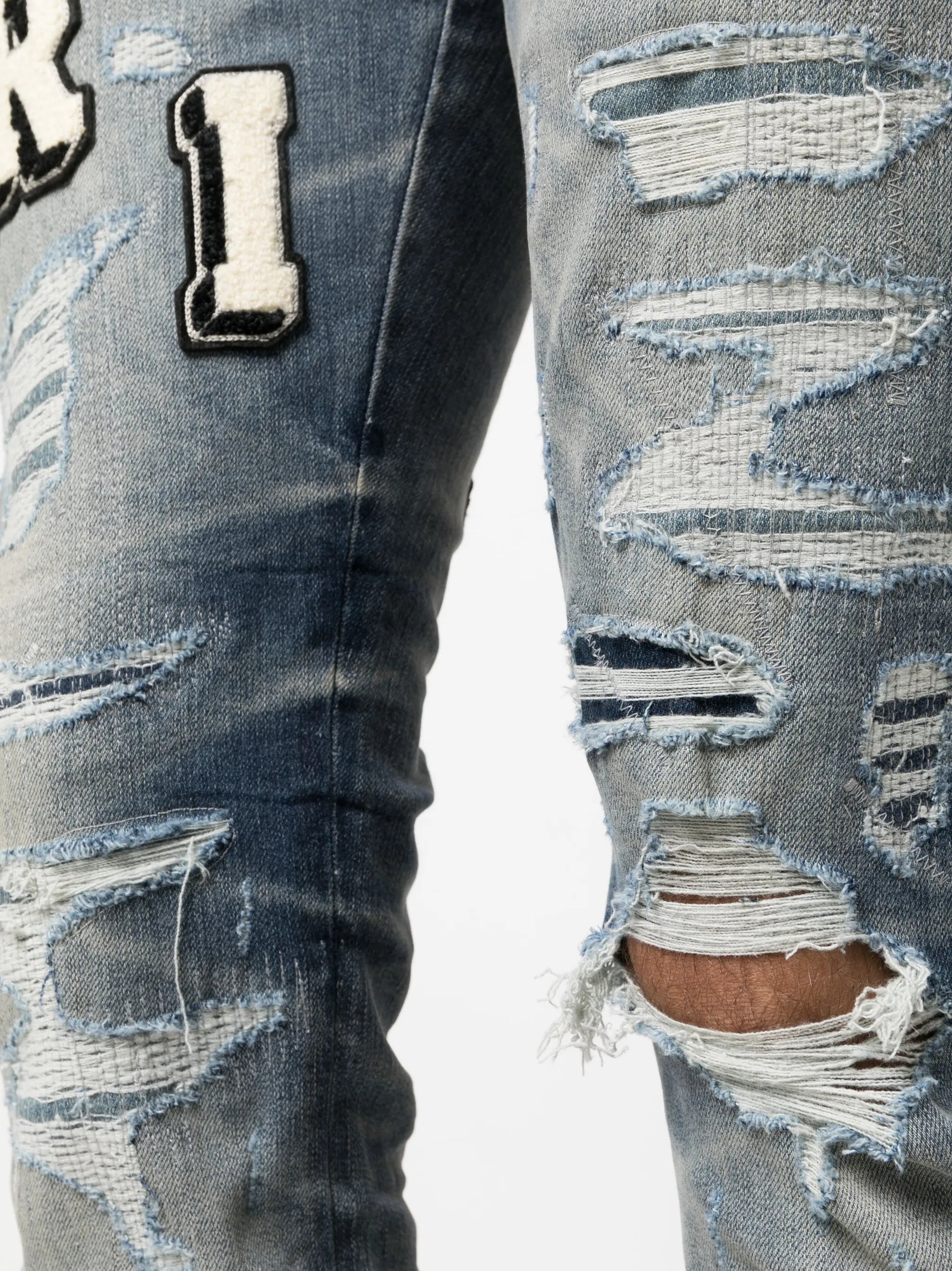Varsity ripped skinny jeans