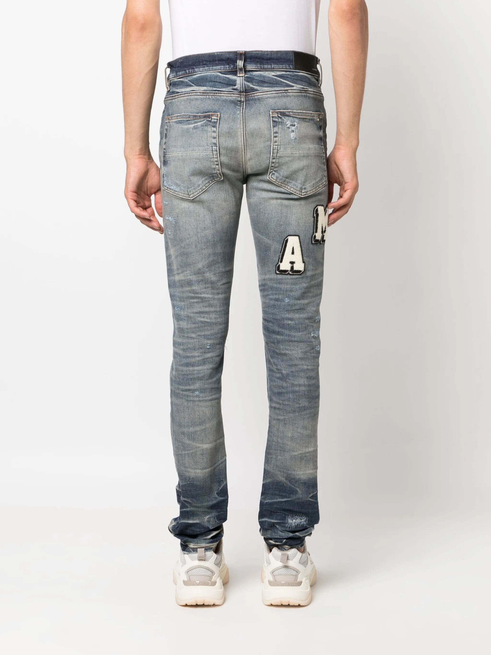Varsity ripped skinny jeans