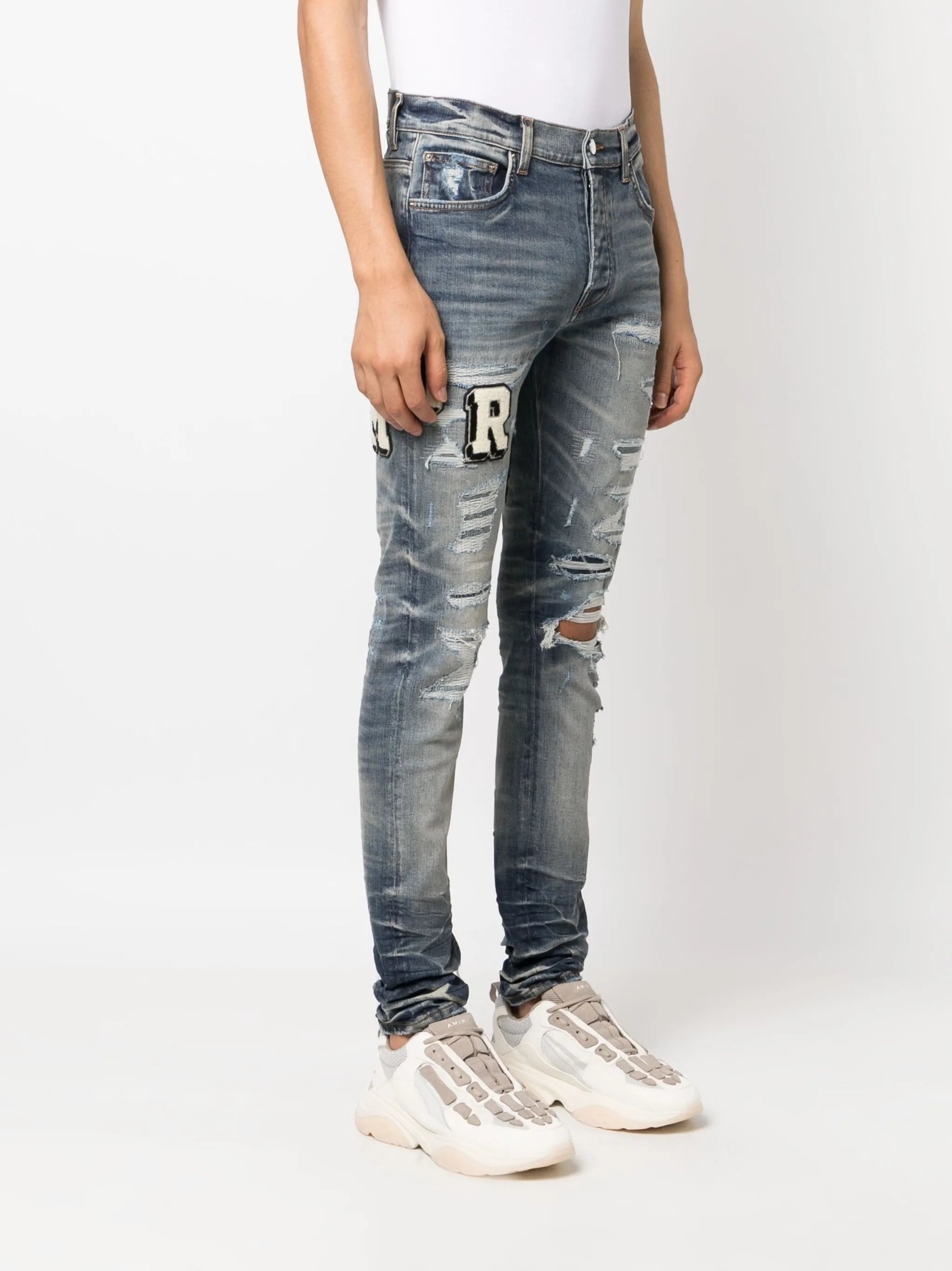 Varsity ripped skinny jeans