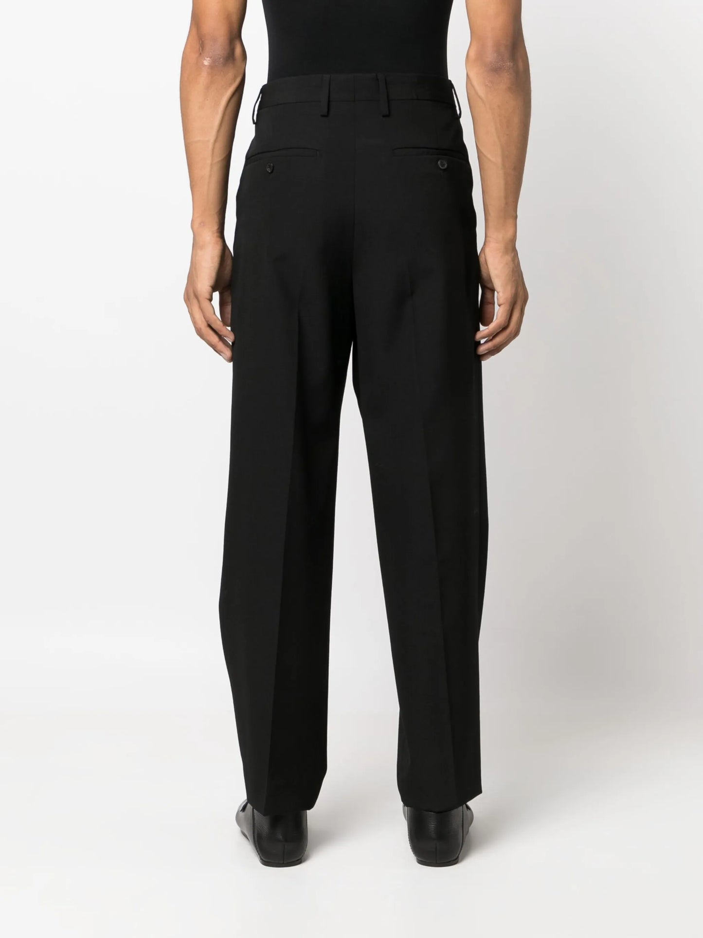 pleated tapered wool trousers