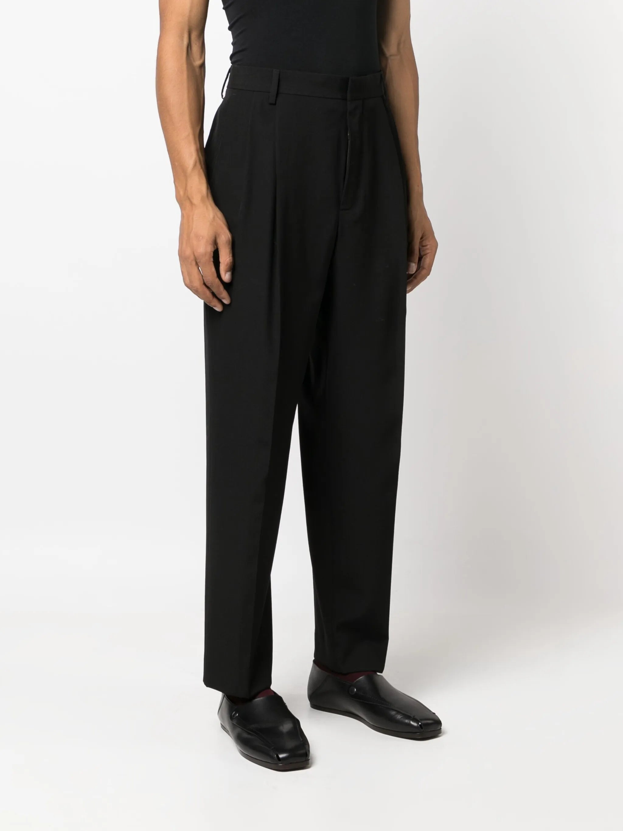 pleated tapered wool trousers