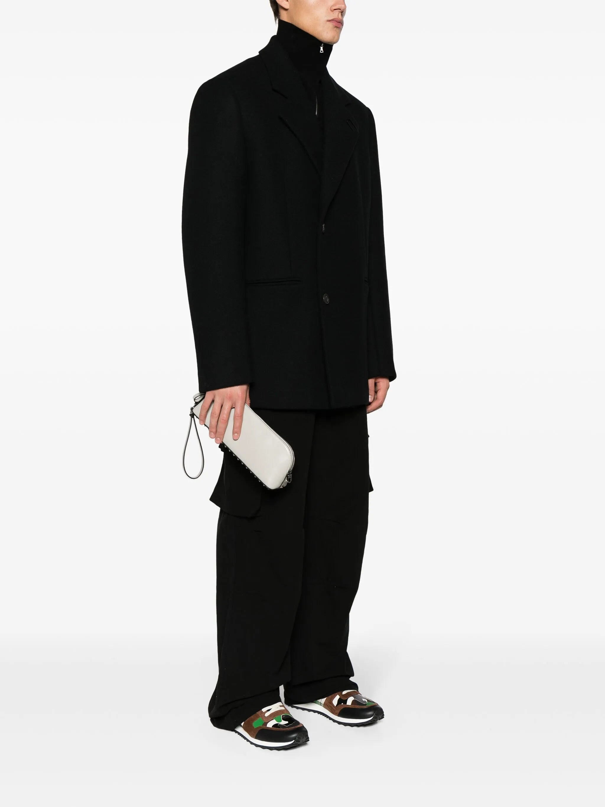 rockstud-detail leather clutch bag