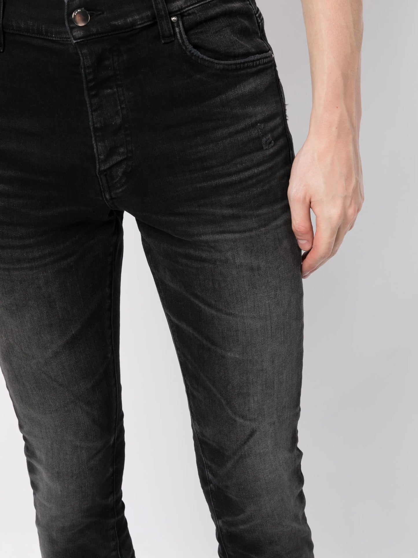 Stack whiskered skinny jeans