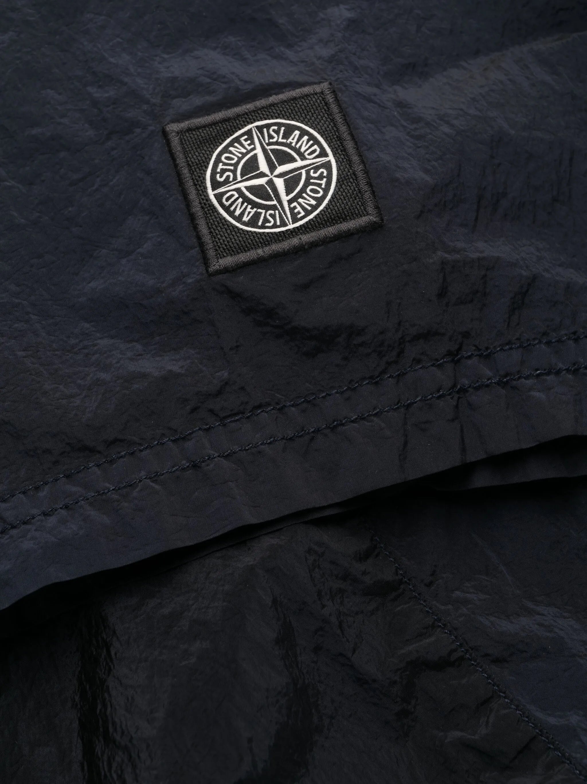 Compass-motif track shorts