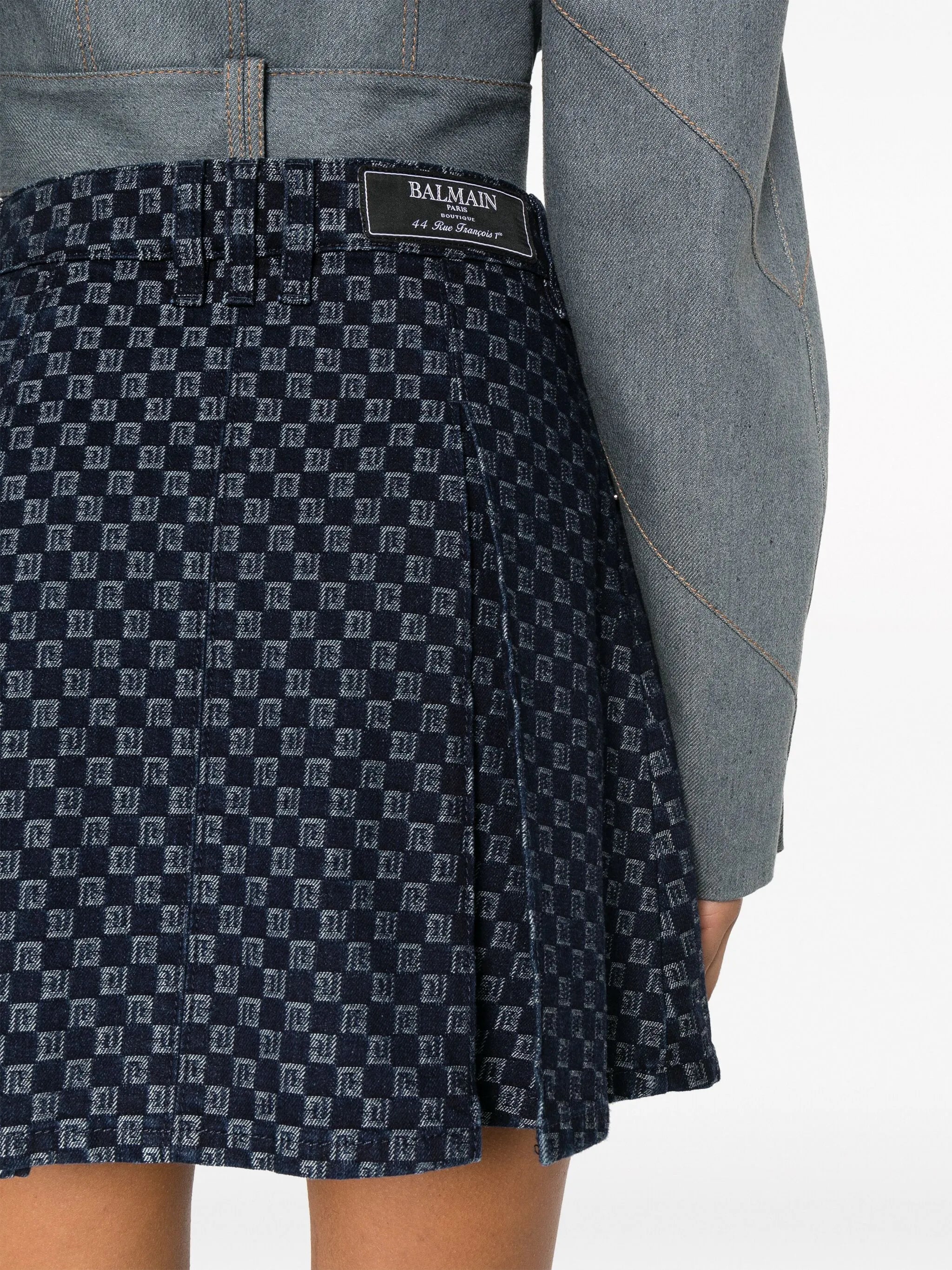 pleated monogram-jacquard denim miniskirt