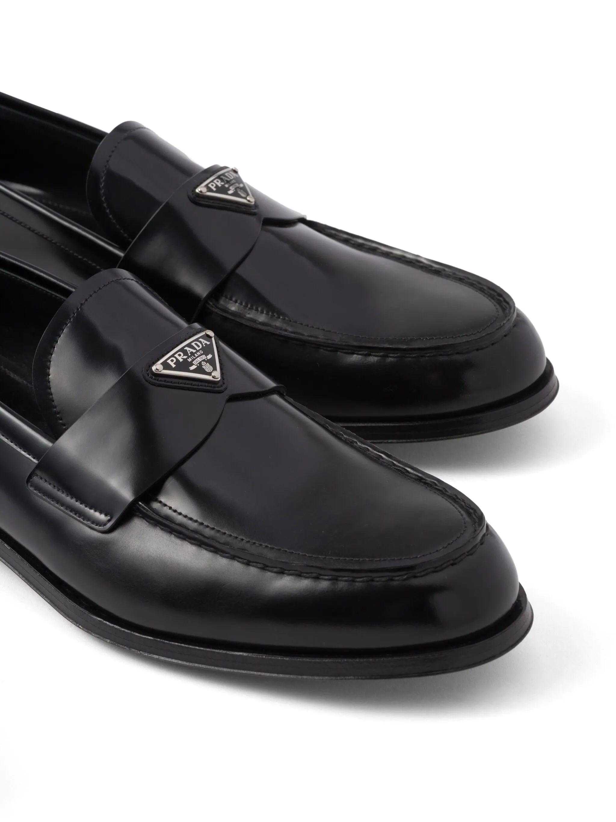 triangle-logo leather loafers