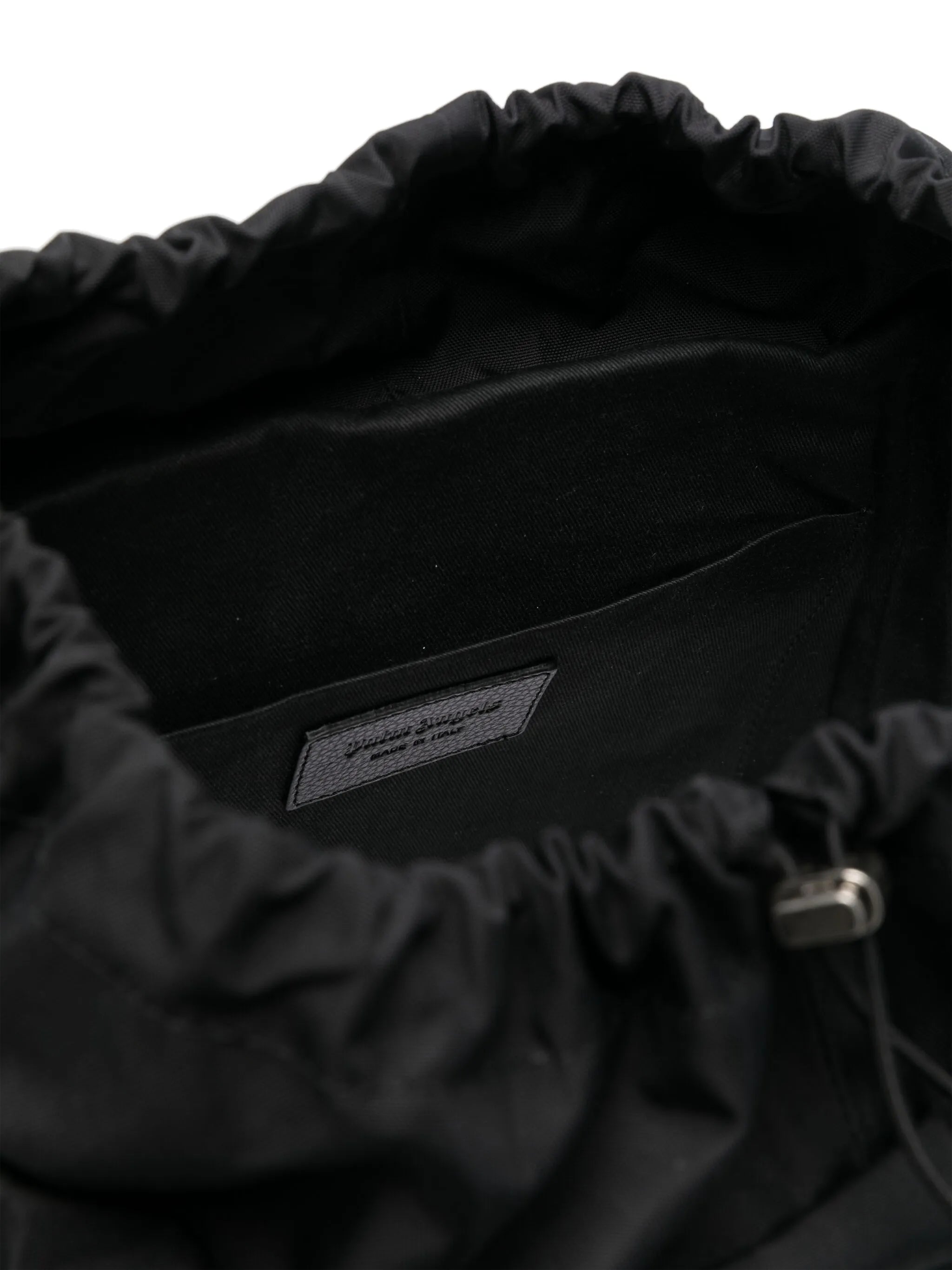 monogram-debossed canvas backpack