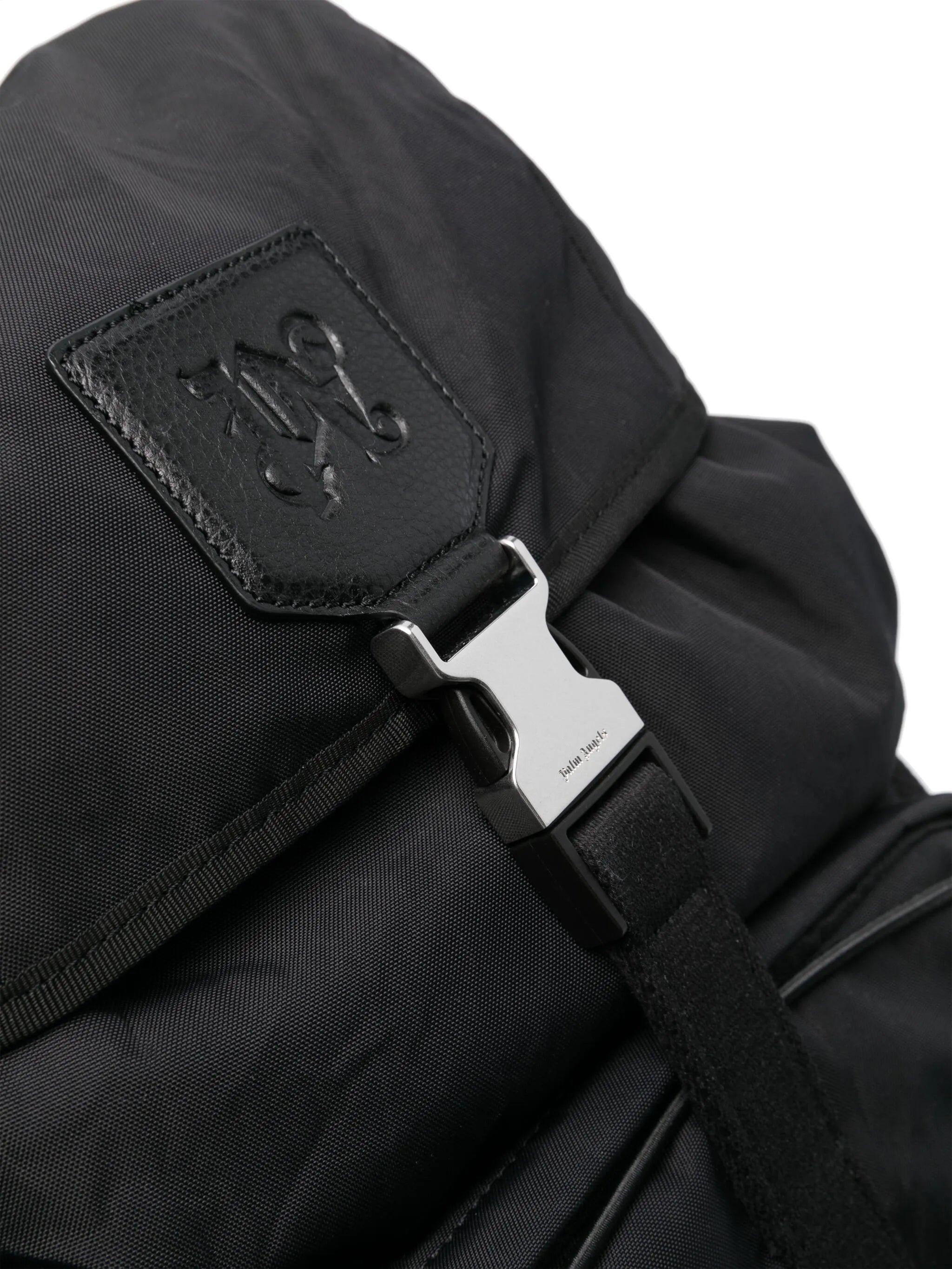 monogram-debossed canvas backpack