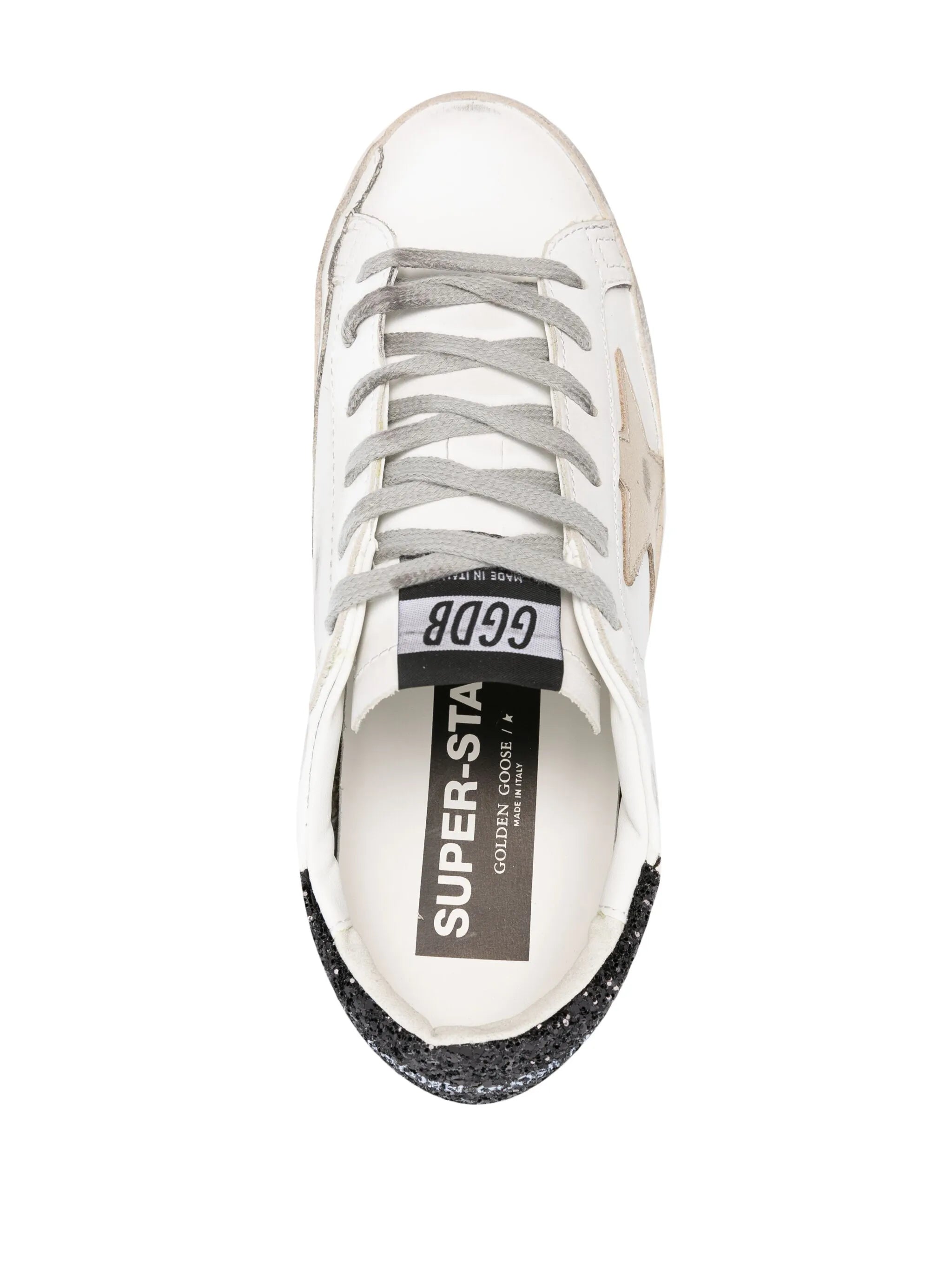 Super-Star trainers with gold star and black glitter heel tab